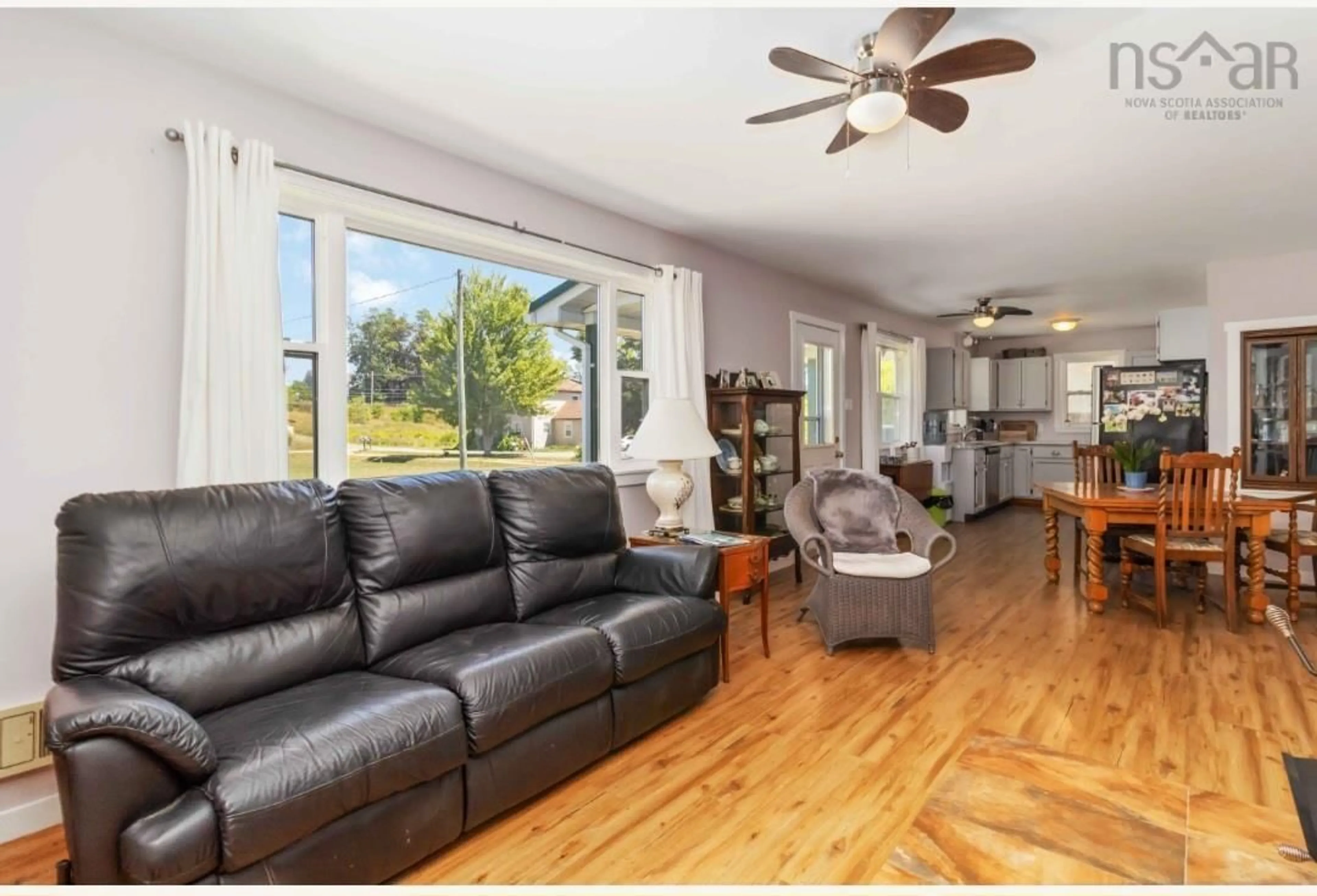 Living room with furniture, wood/laminate floor for 5451 Highway 325, Baker Settlement Nova Scotia B4V 7G1