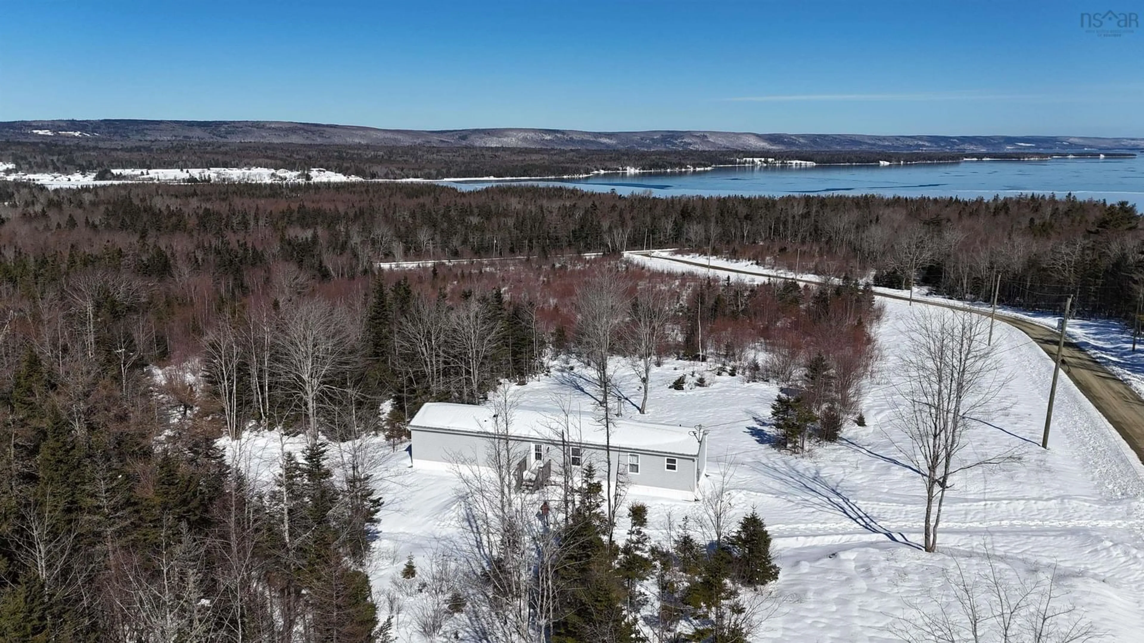 A pic from outside/outdoor area/front of a property/back of a property/a pic from drone, water/lake/river/ocean view for 62 Mash Lane, West Bay Nova Scotia B0E 3K0