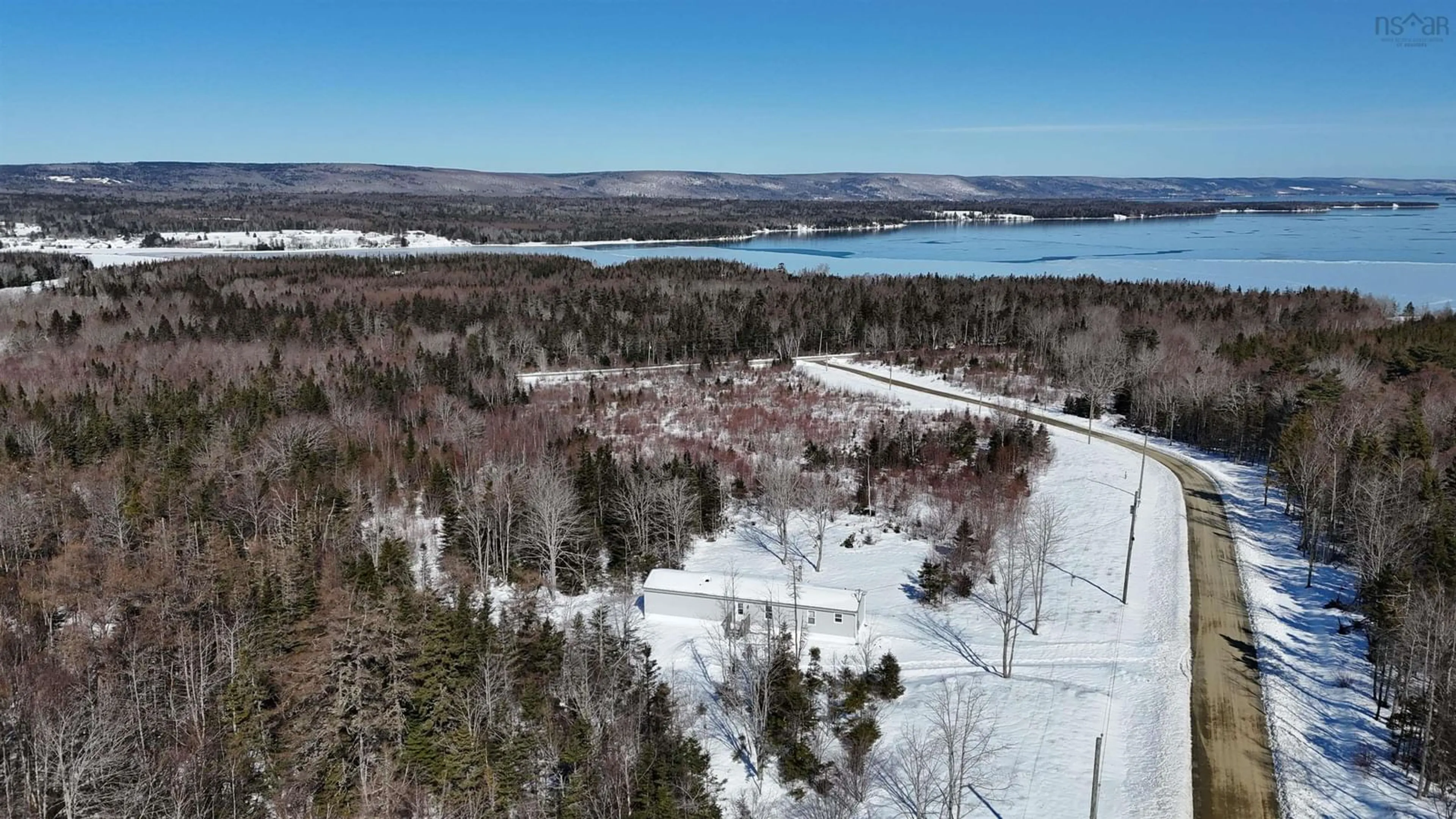 A pic from outside/outdoor area/front of a property/back of a property/a pic from drone, water/lake/river/ocean view for 62 Mash Lane, West Bay Nova Scotia B0E 3K0
