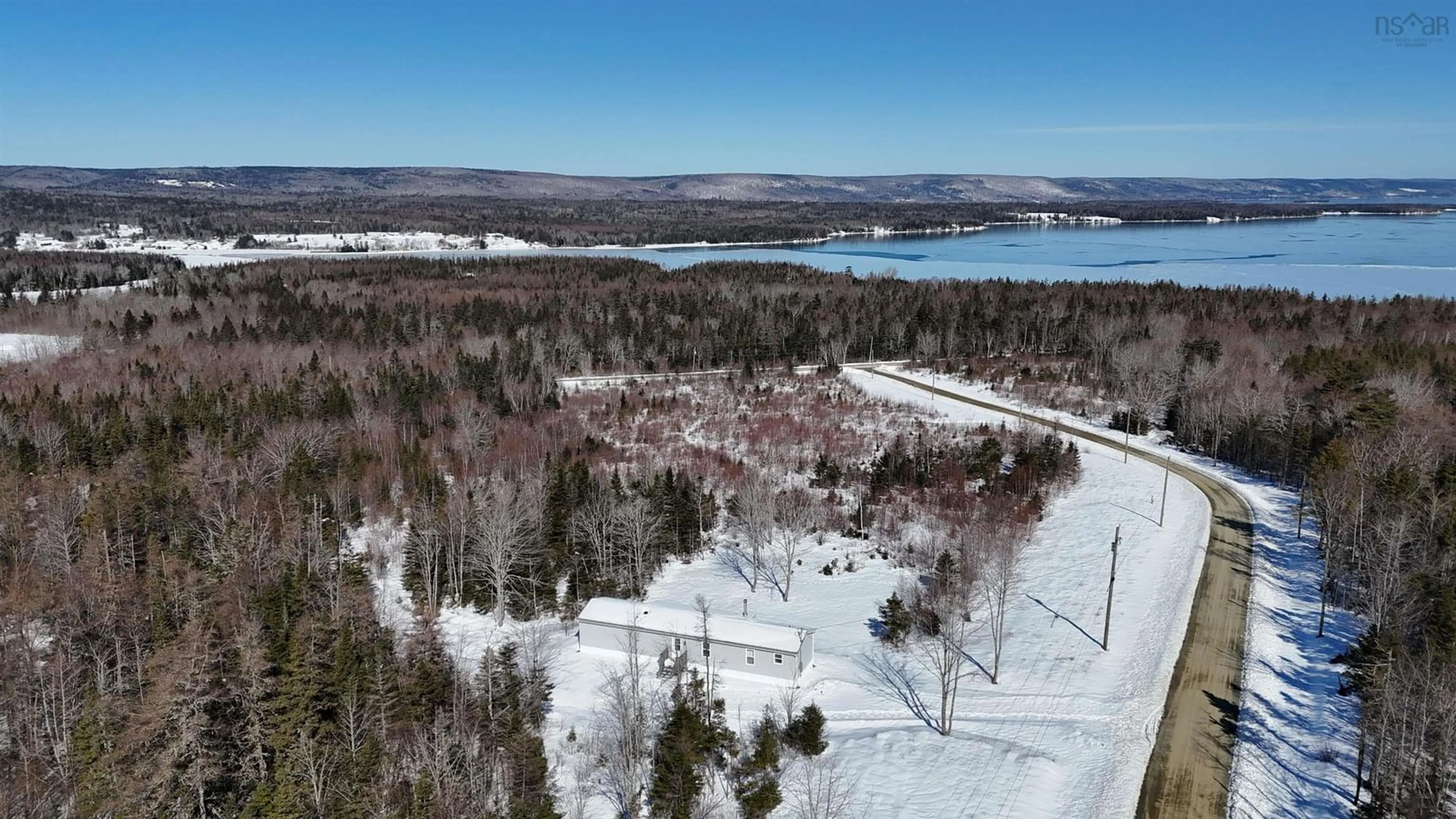 A pic from outside/outdoor area/front of a property/back of a property/a pic from drone, water/lake/river/ocean view for 62 Mash Lane, West Bay Nova Scotia B0E 3K0