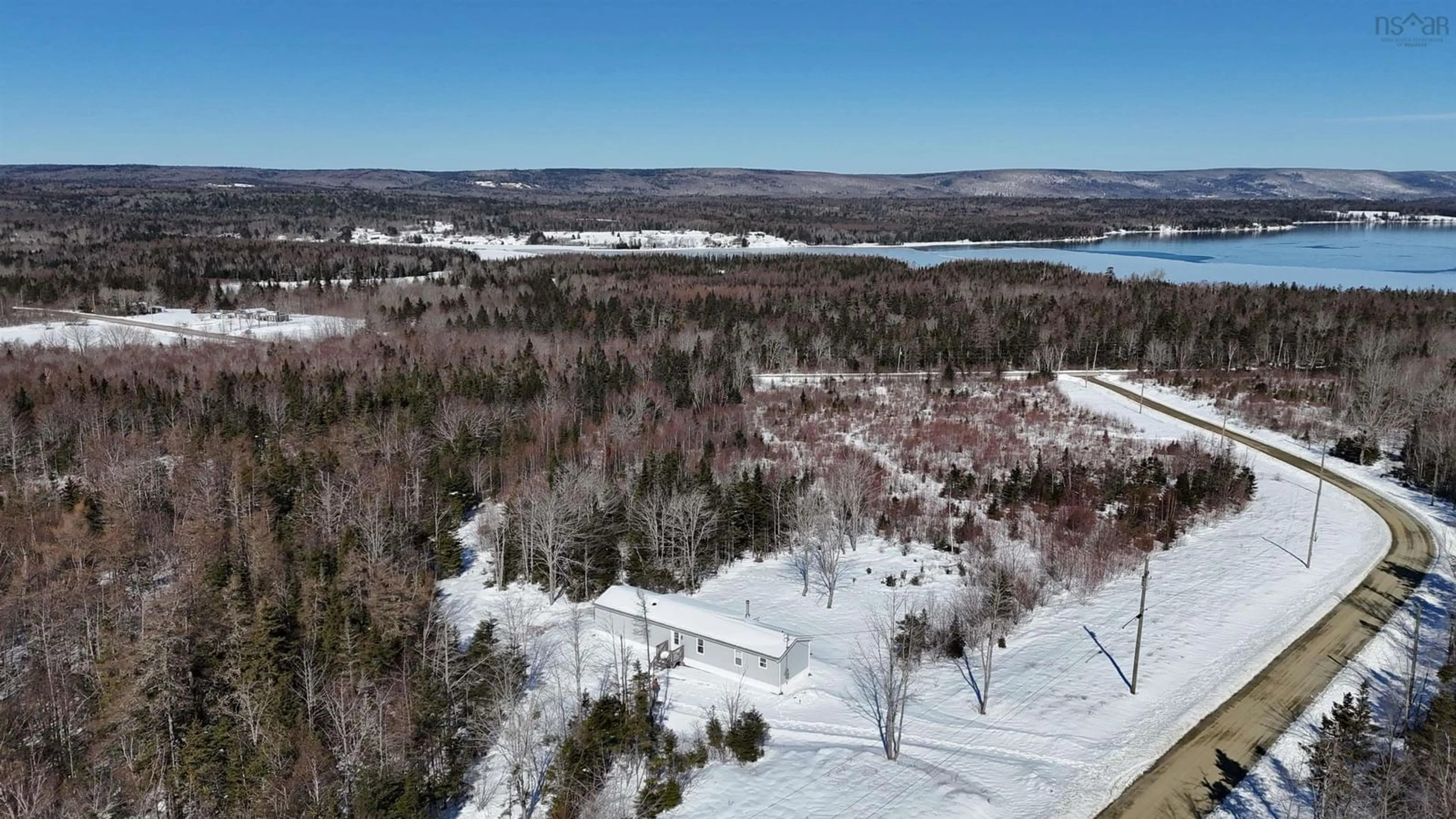 A pic from outside/outdoor area/front of a property/back of a property/a pic from drone, water/lake/river/ocean view for 62 Mash Lane, West Bay Nova Scotia B0E 3K0