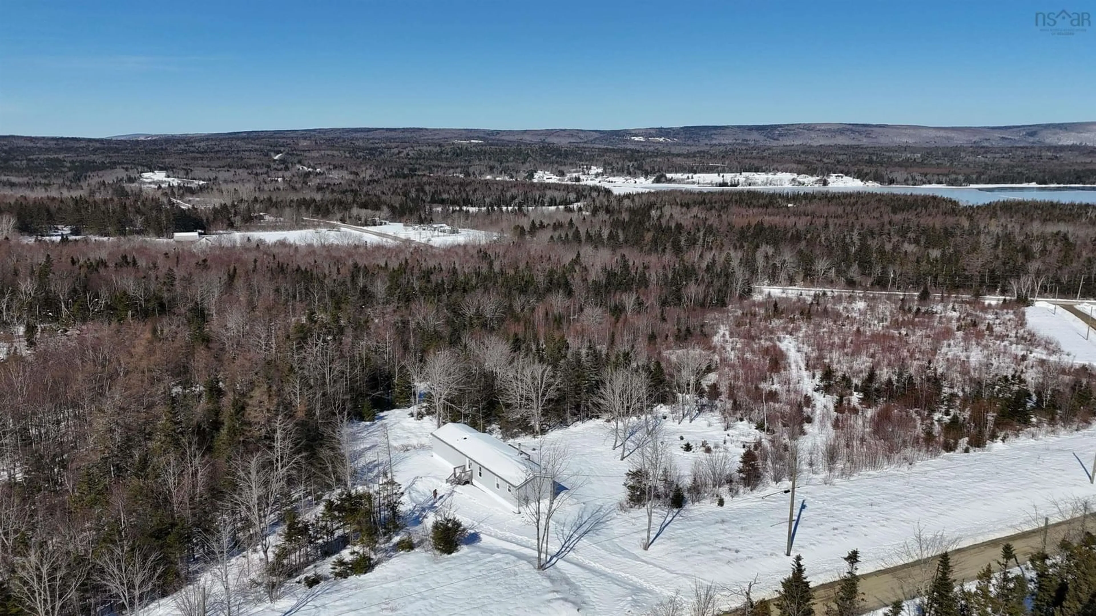 A pic from outside/outdoor area/front of a property/back of a property/a pic from drone, forest/trees view for 62 Mash Lane, West Bay Nova Scotia B0E 3K0
