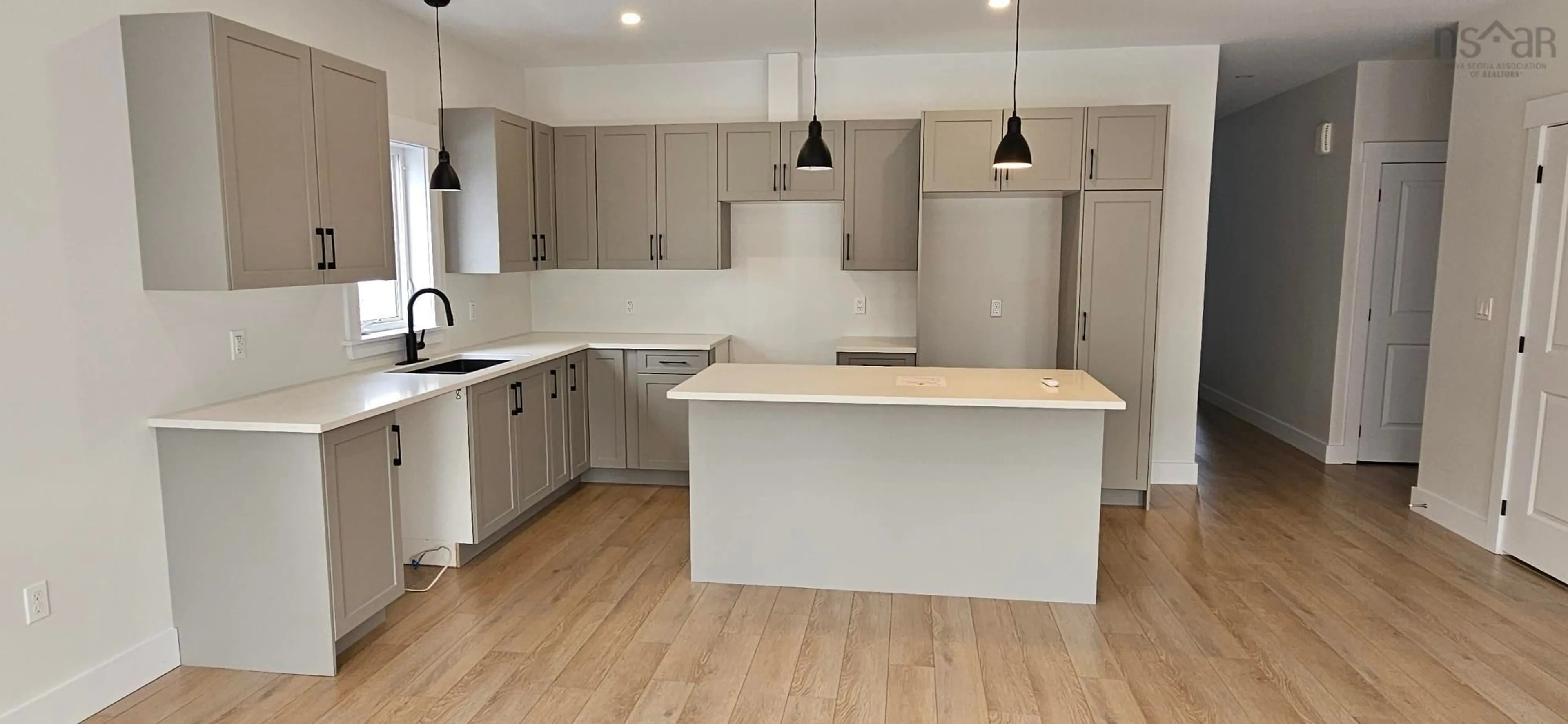 Open concept kitchen, wood/laminate floor for 21 Ridge Ave, Stewiacke Nova Scotia B0N 2J0