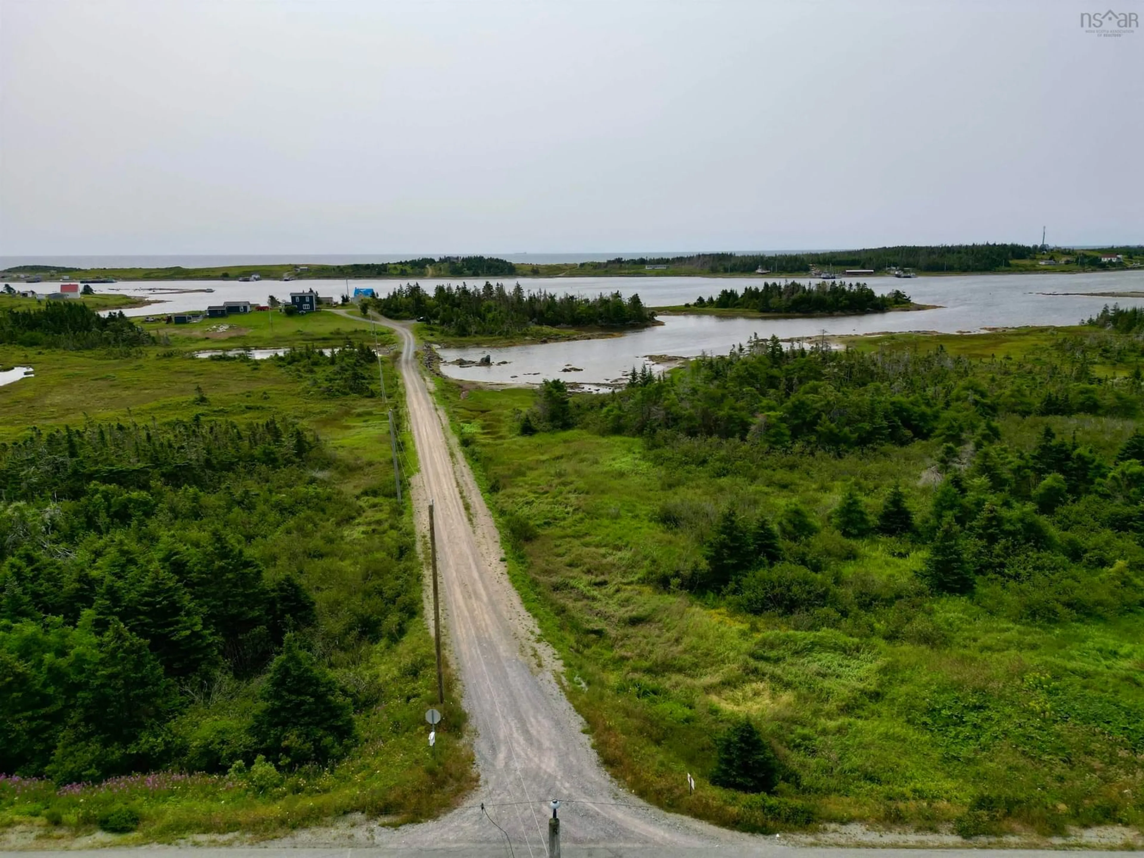 A pic from outside/outdoor area/front of a property/back of a property/a pic from drone, water/lake/river/ocean view for 9684 St. Peter's Fourchu Rd., Fourchu Nova Scotia B2J 1A5