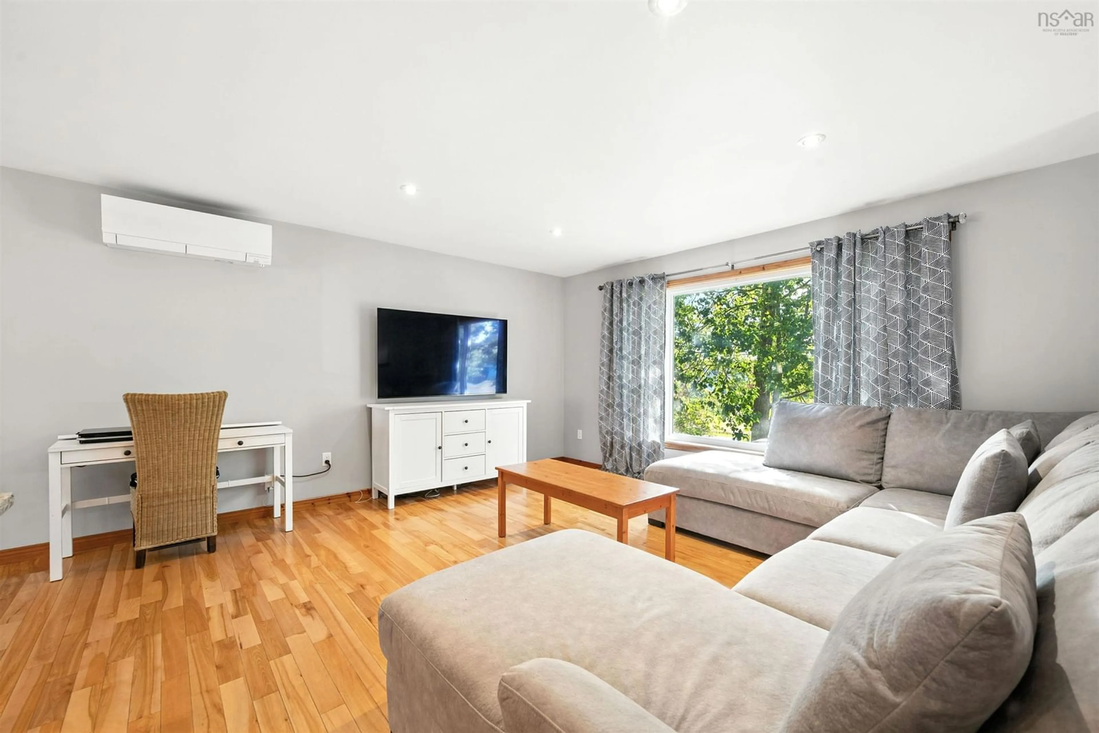 Living room with furniture, wood/laminate floor for 24 Aylward Rd, Falmouth Nova Scotia B0P 1P0