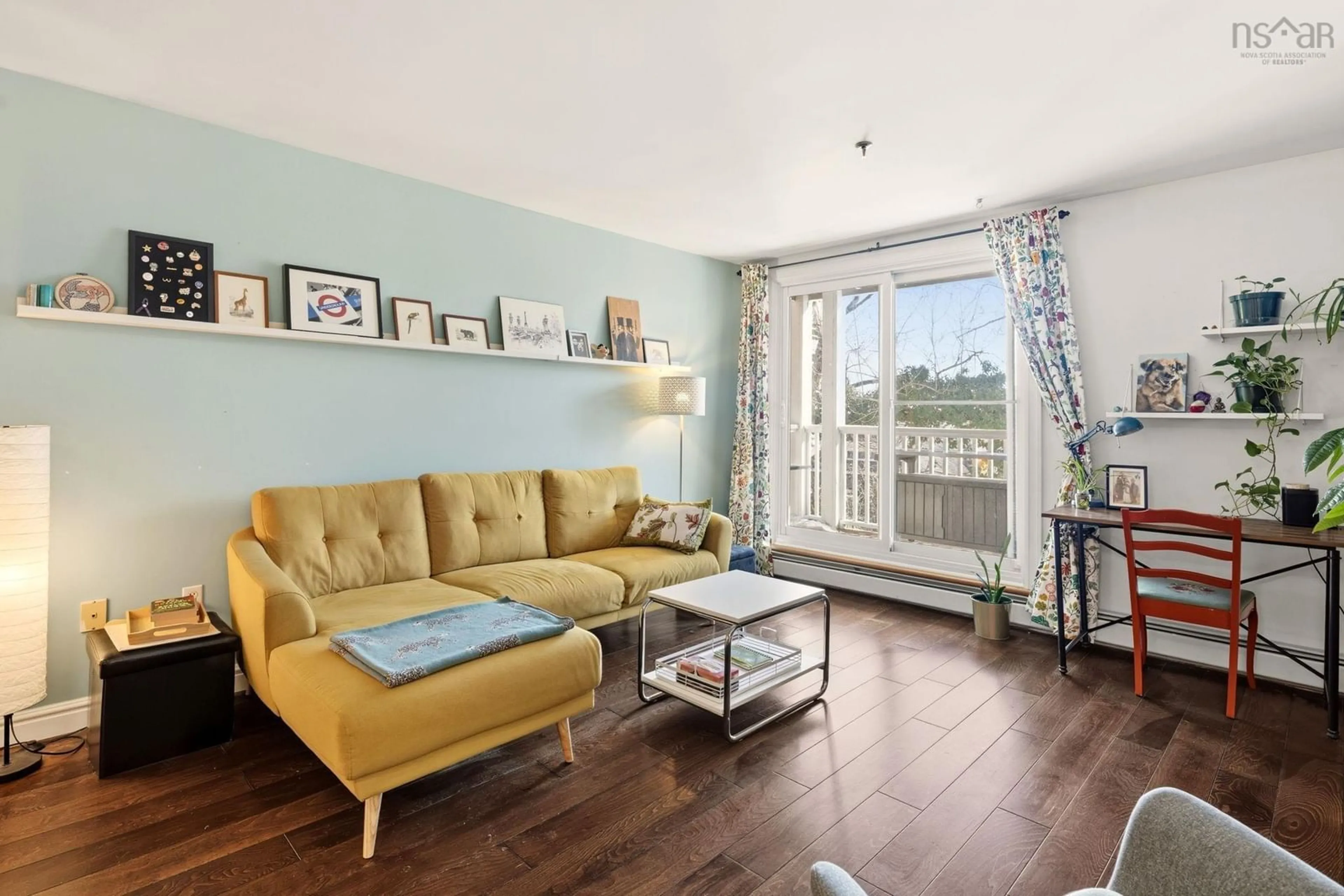 Living room with furniture, wood/laminate floor for 5230 Tobin St #209, Halifax Nova Scotia B3H 1S2