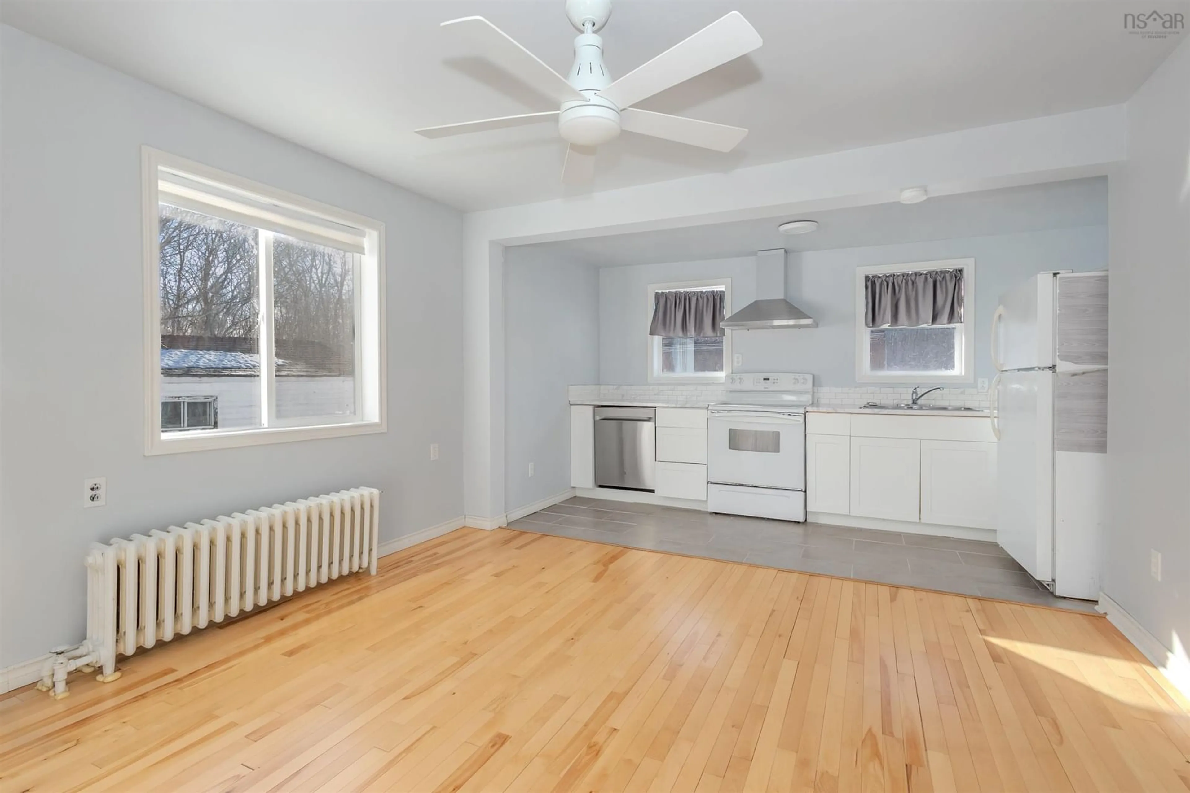 Open concept kitchen, wood/laminate floor for 7 Cochrane St, Glace Bay Nova Scotia B1A 2W5