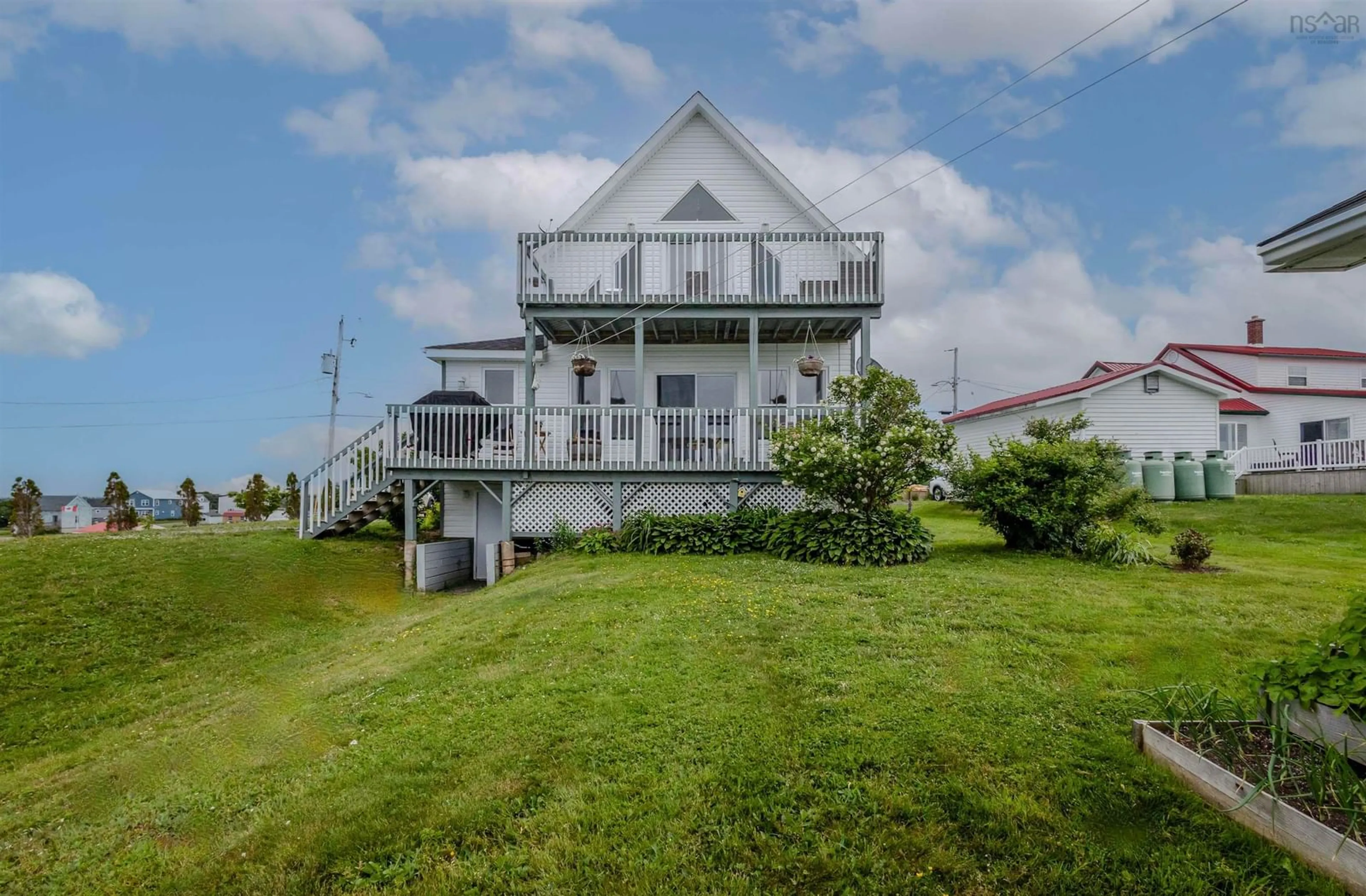 A pic from outside/outdoor area/front of a property/back of a property/a pic from drone, water/lake/river/ocean view for 36 Seaview Dr, Gabarus Village Nova Scotia B1K 3T4