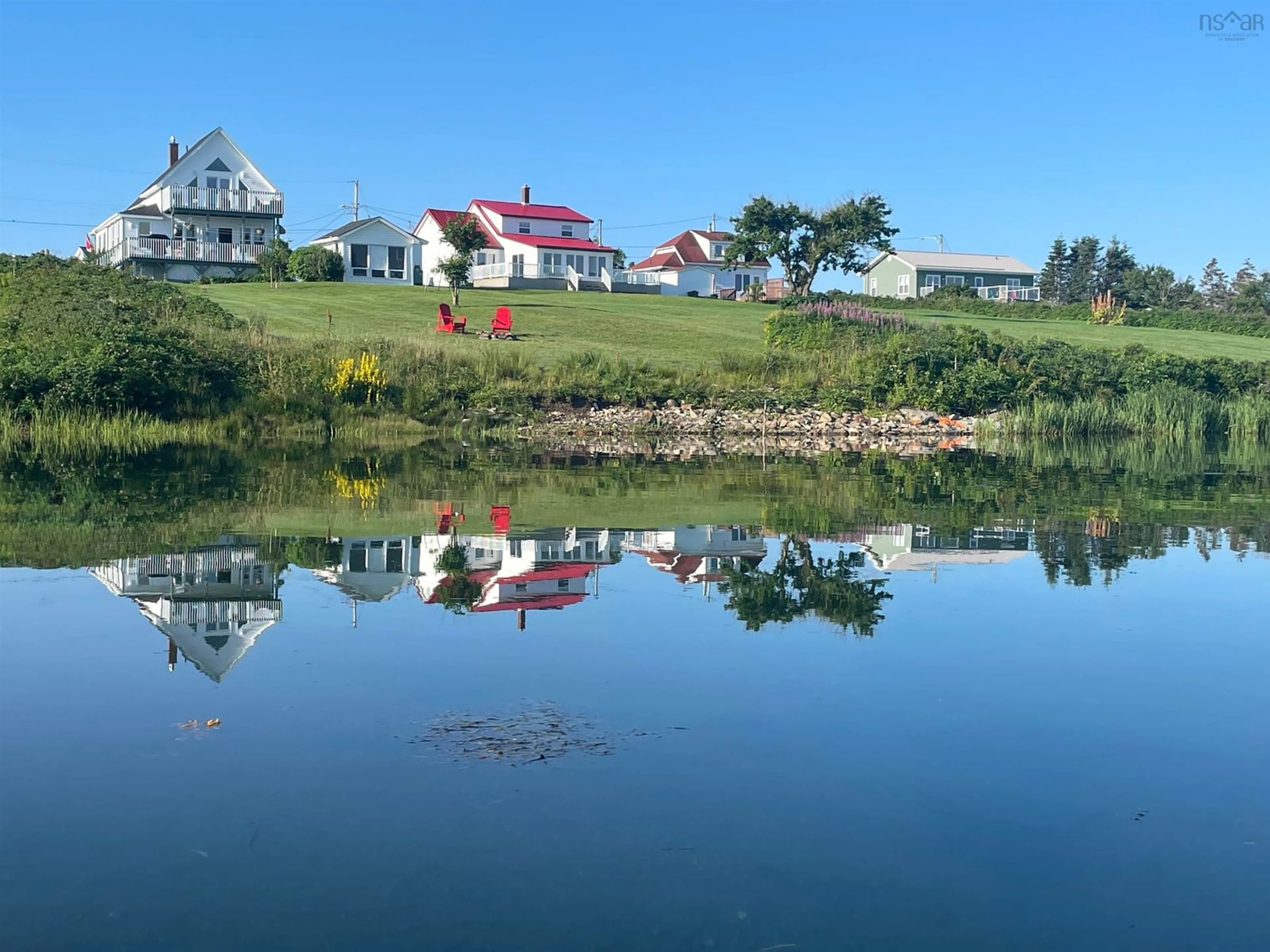A pic from outside/outdoor area/front of a property/back of a property/a pic from drone, water/lake/river/ocean view for 36 Seaview Dr, Gabarus Village Nova Scotia B1K 3T4