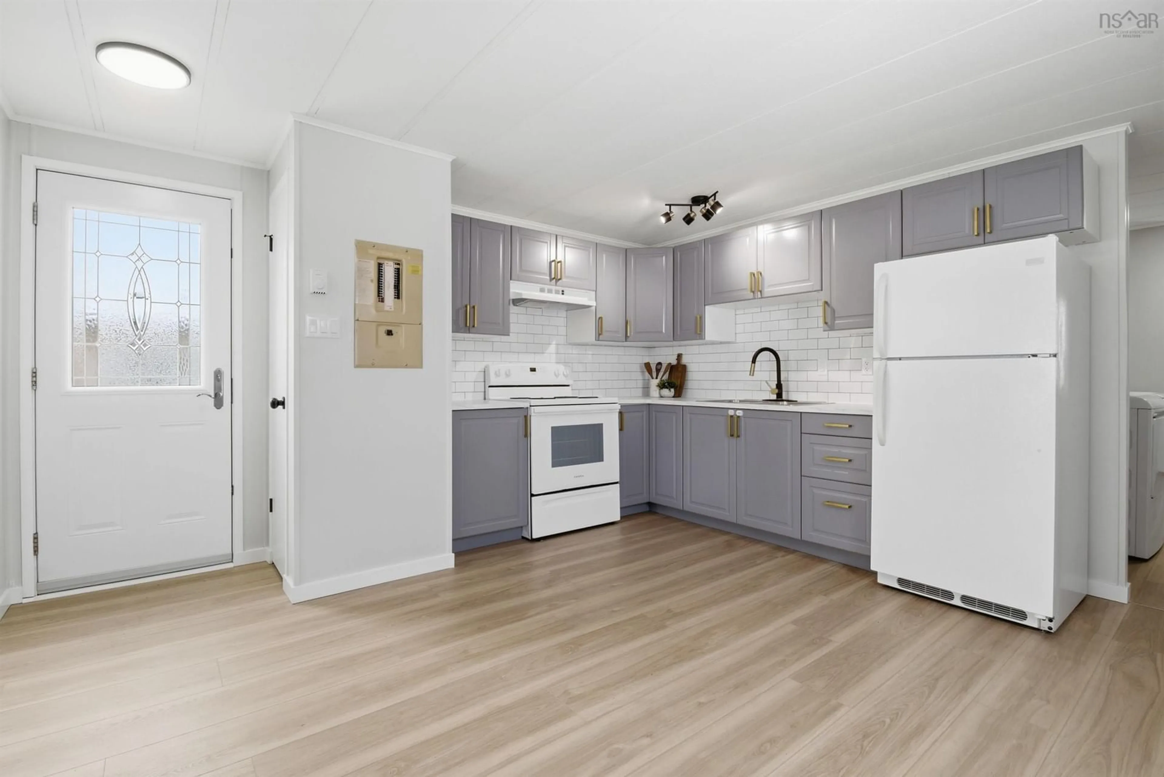 Open concept kitchen, wood/laminate floor for 21 Moore Dr, Middle Sackville Nova Scotia B4E 2Y5
