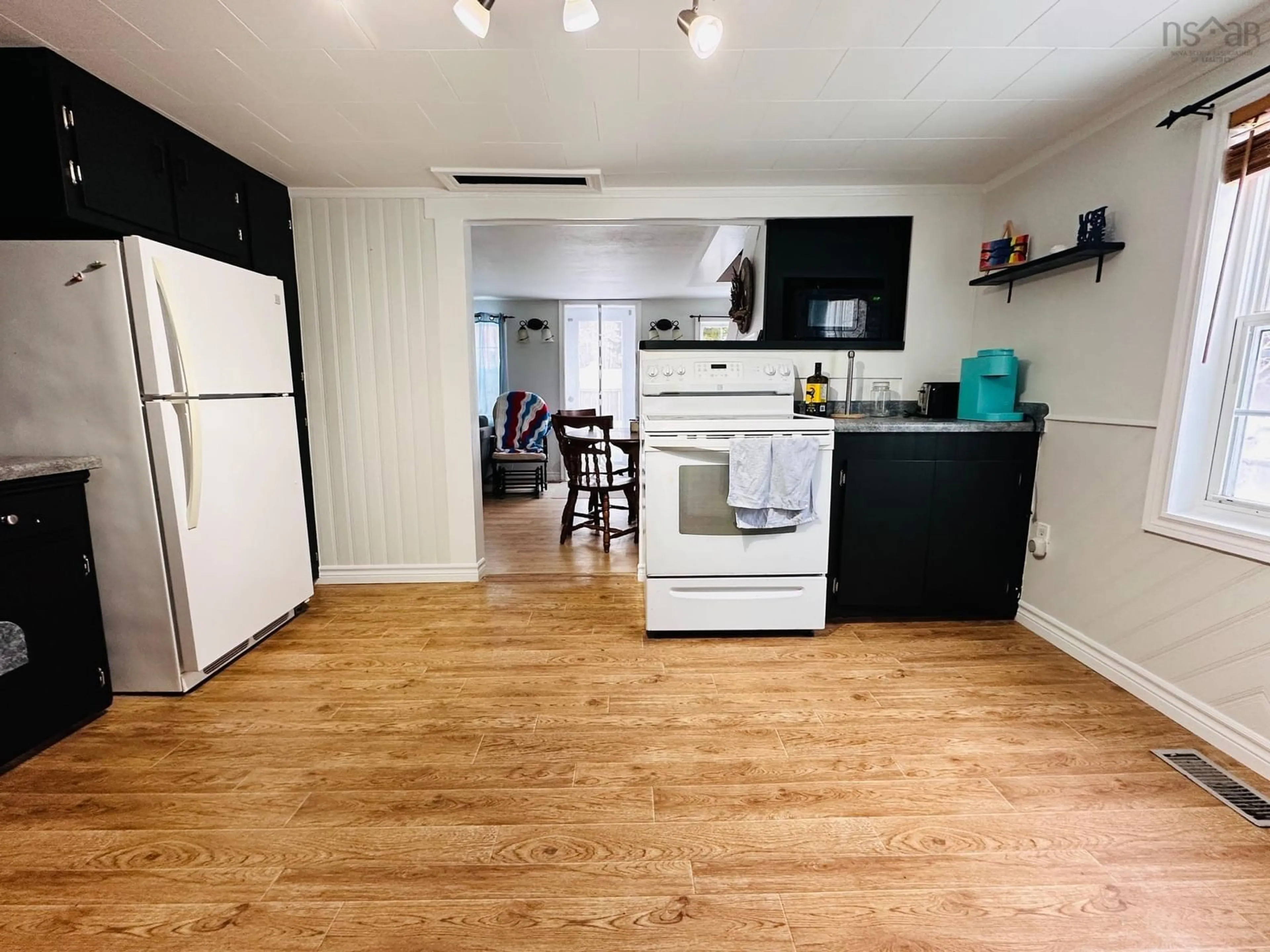 Open concept kitchen, wood/laminate floor for 65 Town Lake Rd, Liverpool Nova Scotia B0T 1K0