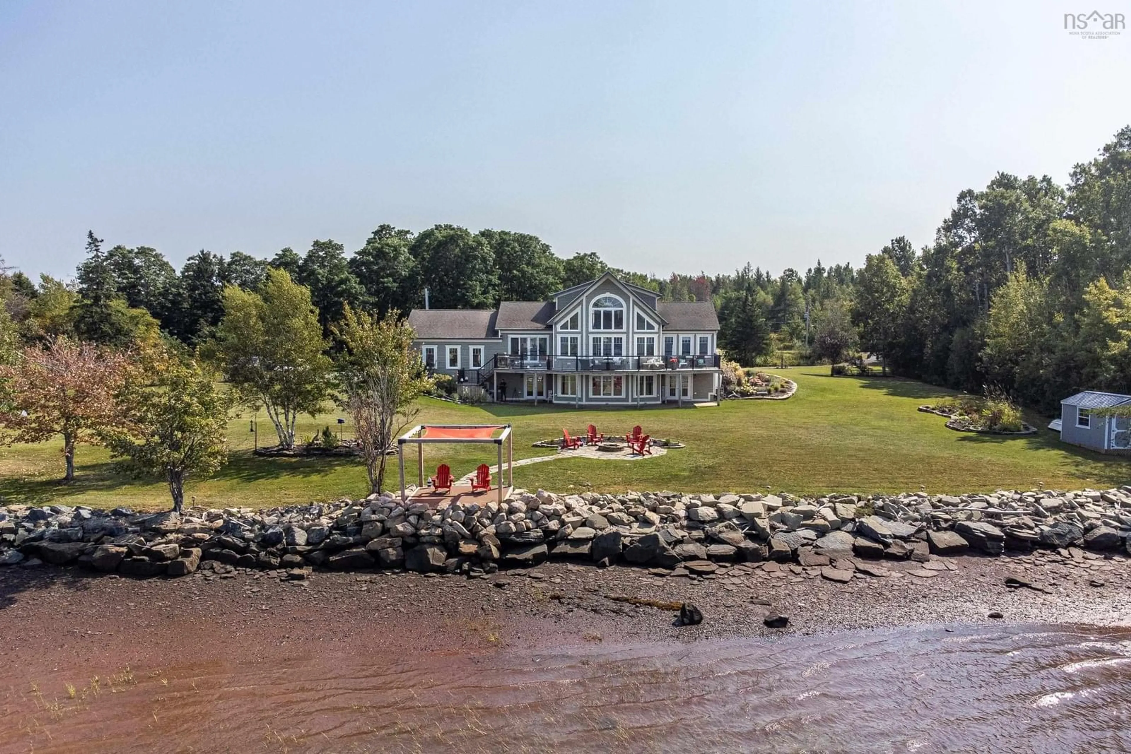 A pic from outside/outdoor area/front of a property/back of a property/a pic from drone, water/lake/river/ocean view for 13573 Highway 6, Wallace Bridge Nova Scotia B0K 1Y0