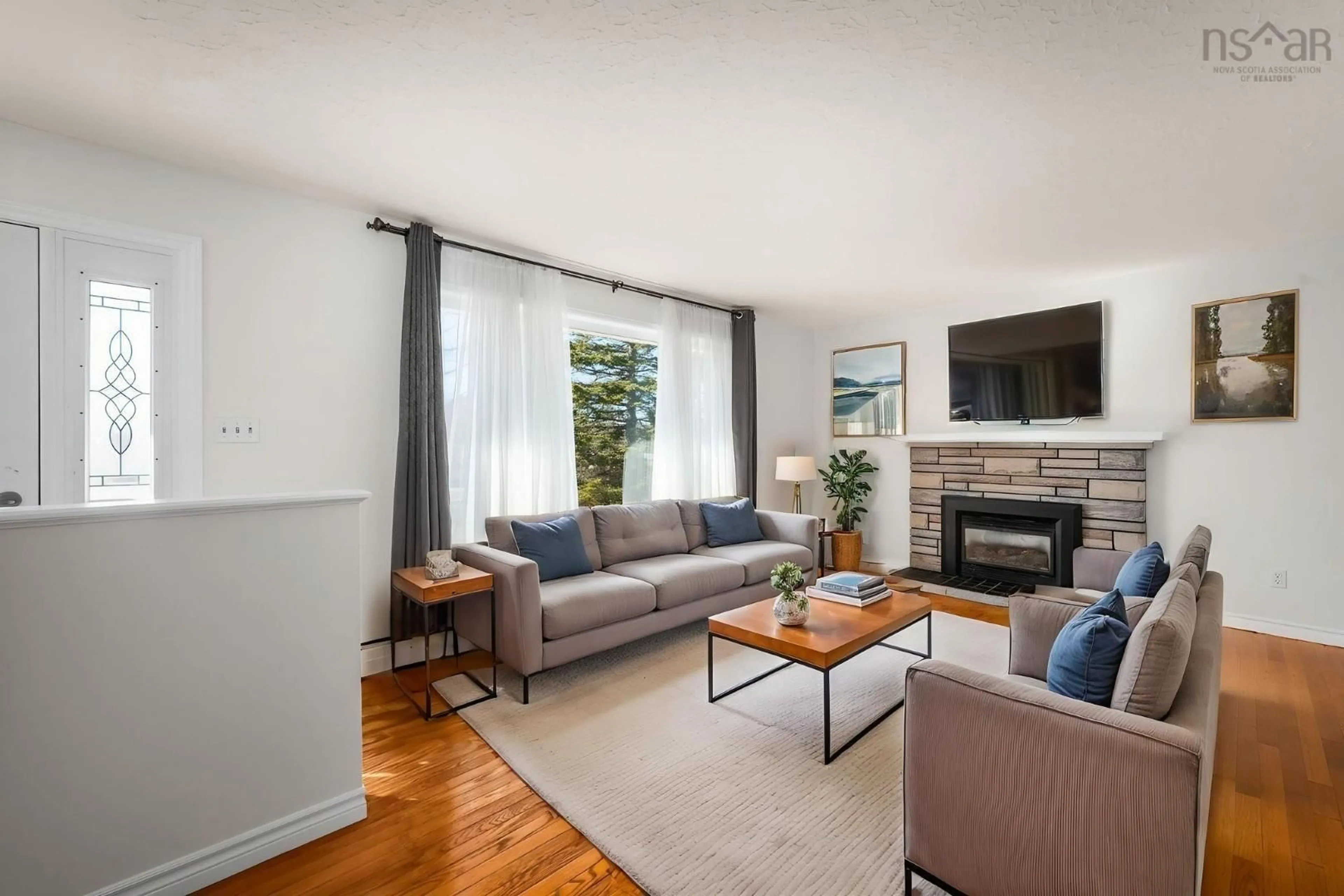 Living room with furniture, wood/laminate floor for 21 Smith Ave, Cole Harbour Nova Scotia B2V 1M3
