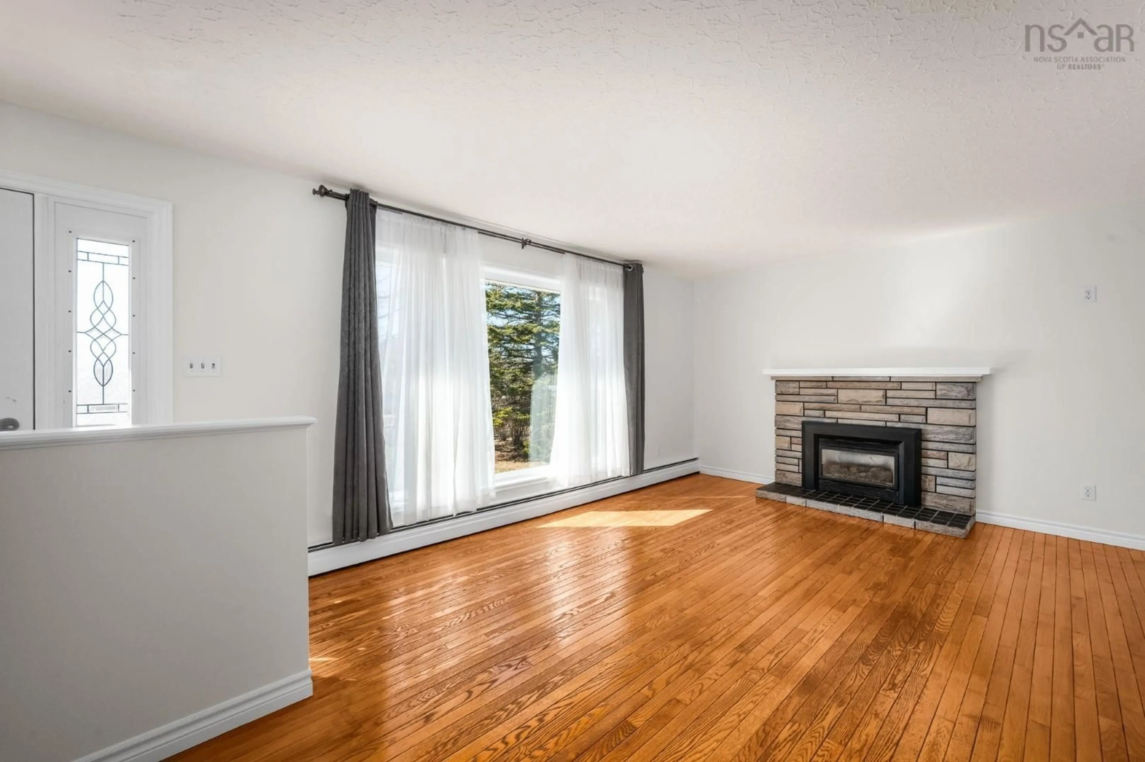 Living room with furniture, wood/laminate floor for 21 Smith Ave, Cole Harbour Nova Scotia B2V 1M3