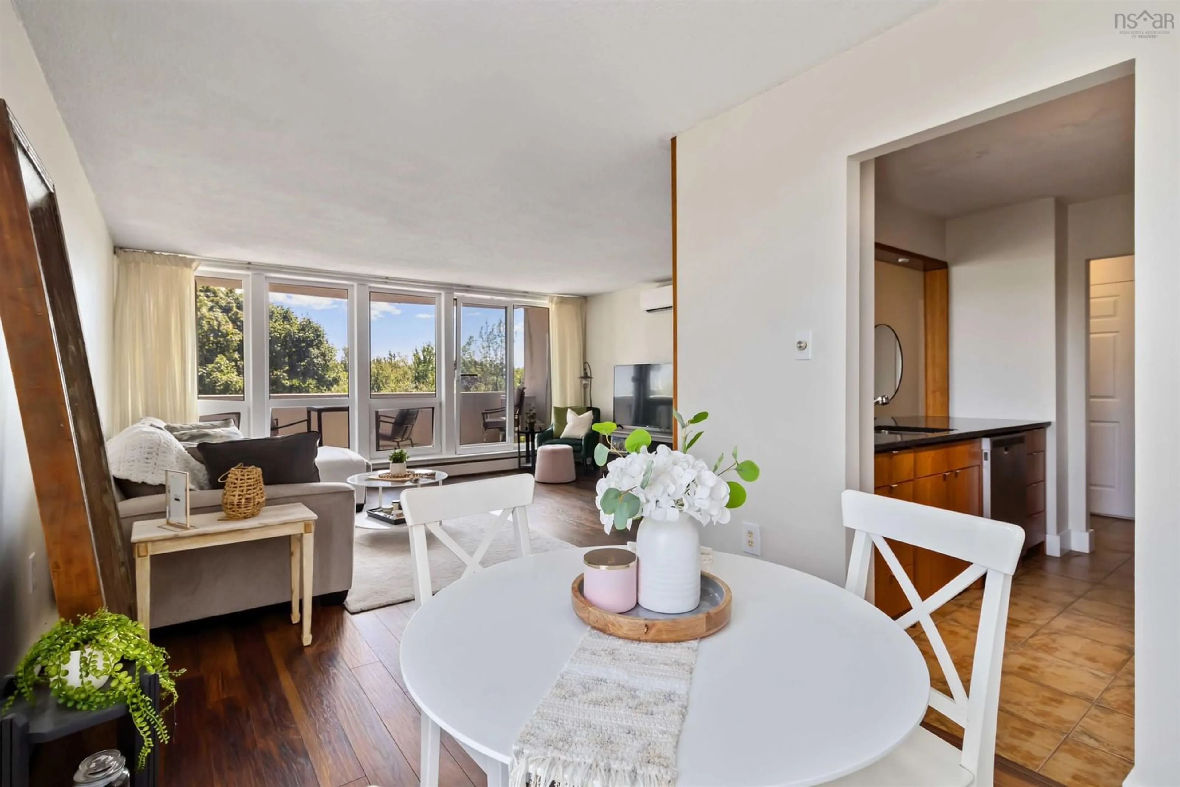 Living room with furniture, wood/laminate floor for 105 Dunbrack St #109, Halifax Nova Scotia B3M 3B7