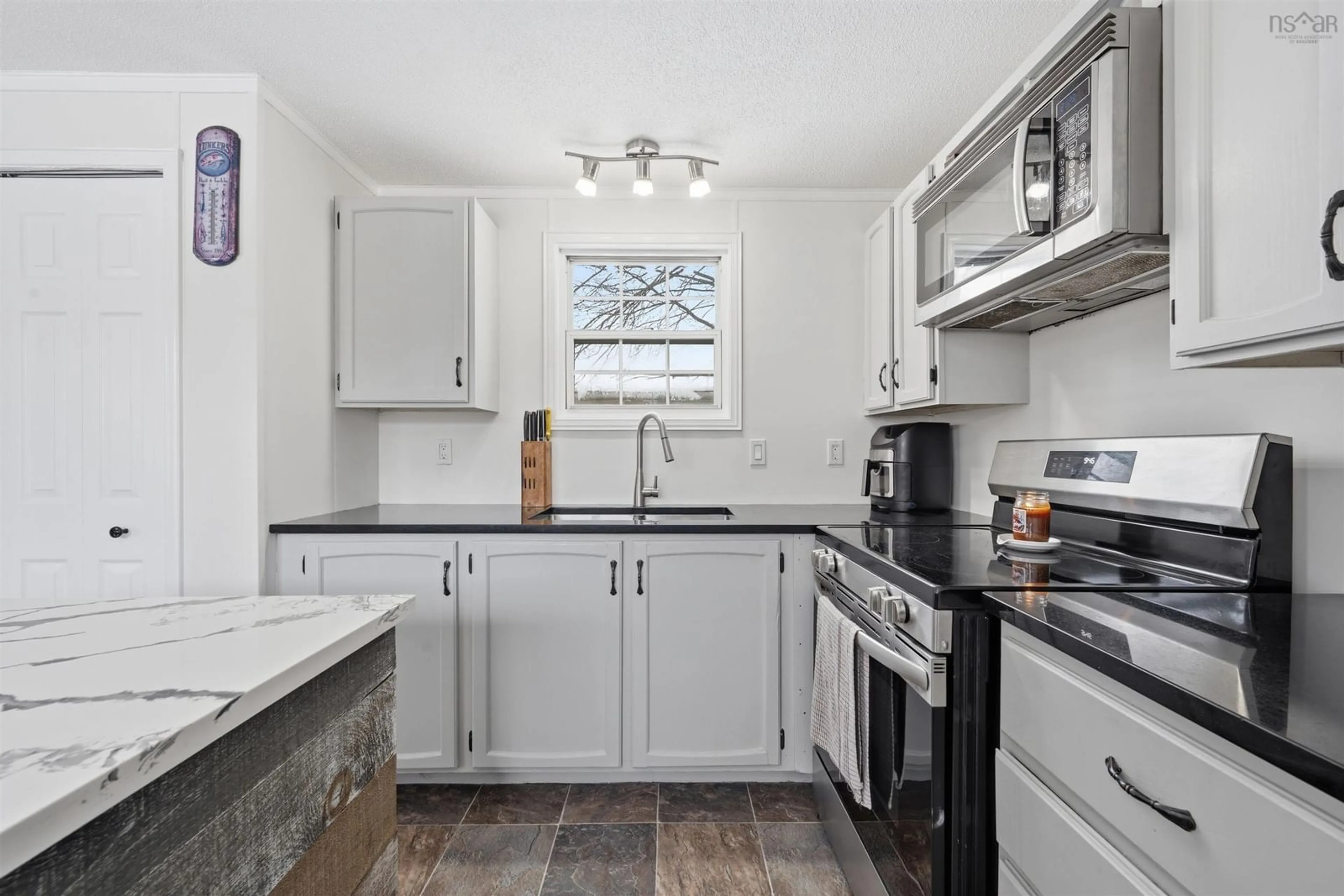 Standard kitchen, ceramic/tile floor for 30 Champlain Ave, Middle Sackville Nova Scotia B4E 3B2
