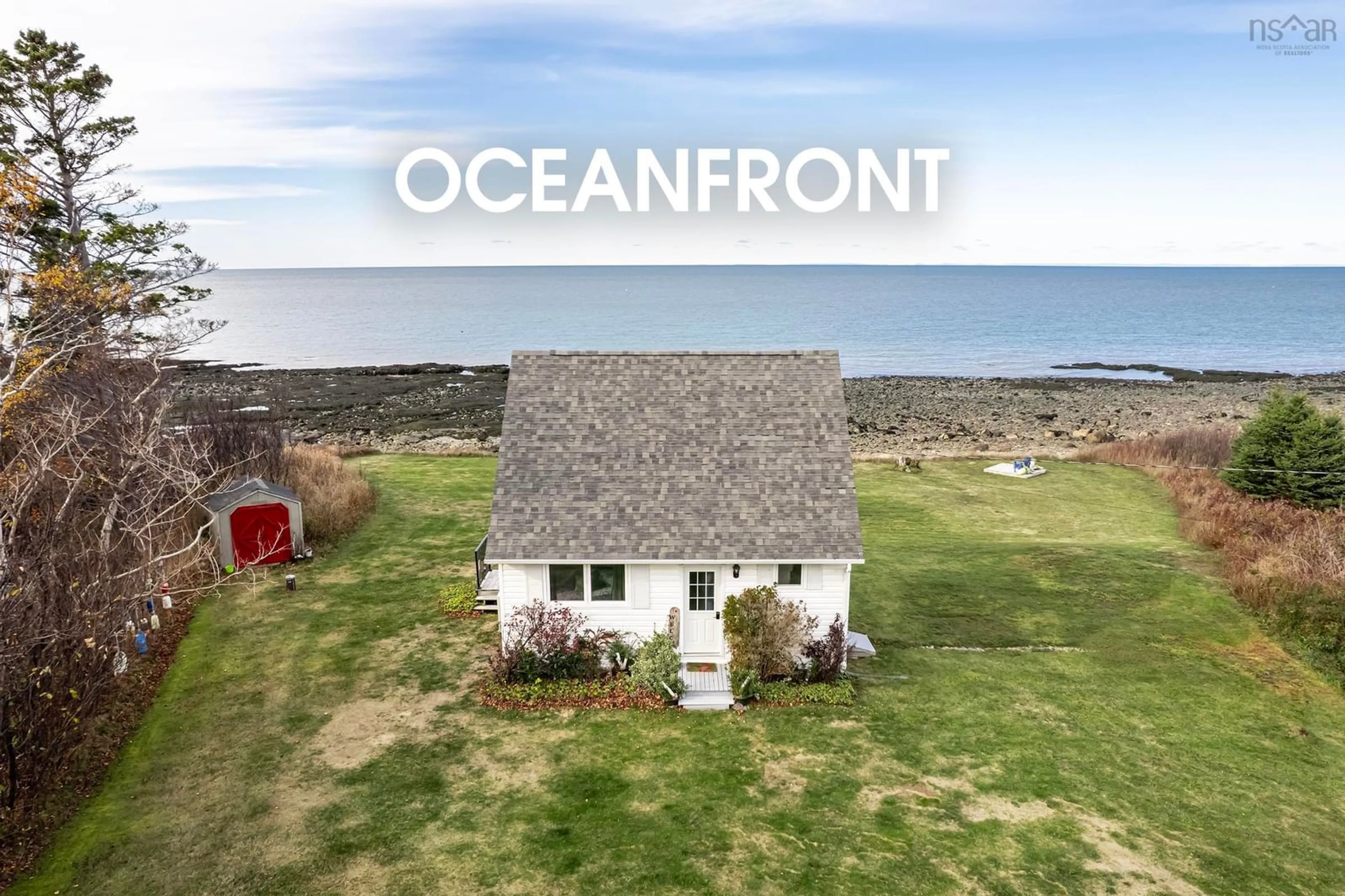 A pic from outside/outdoor area/front of a property/back of a property/a pic from drone, water/lake/river/ocean view for 5015 Shore Rd, Parkers Cove Nova Scotia B0S 1A0