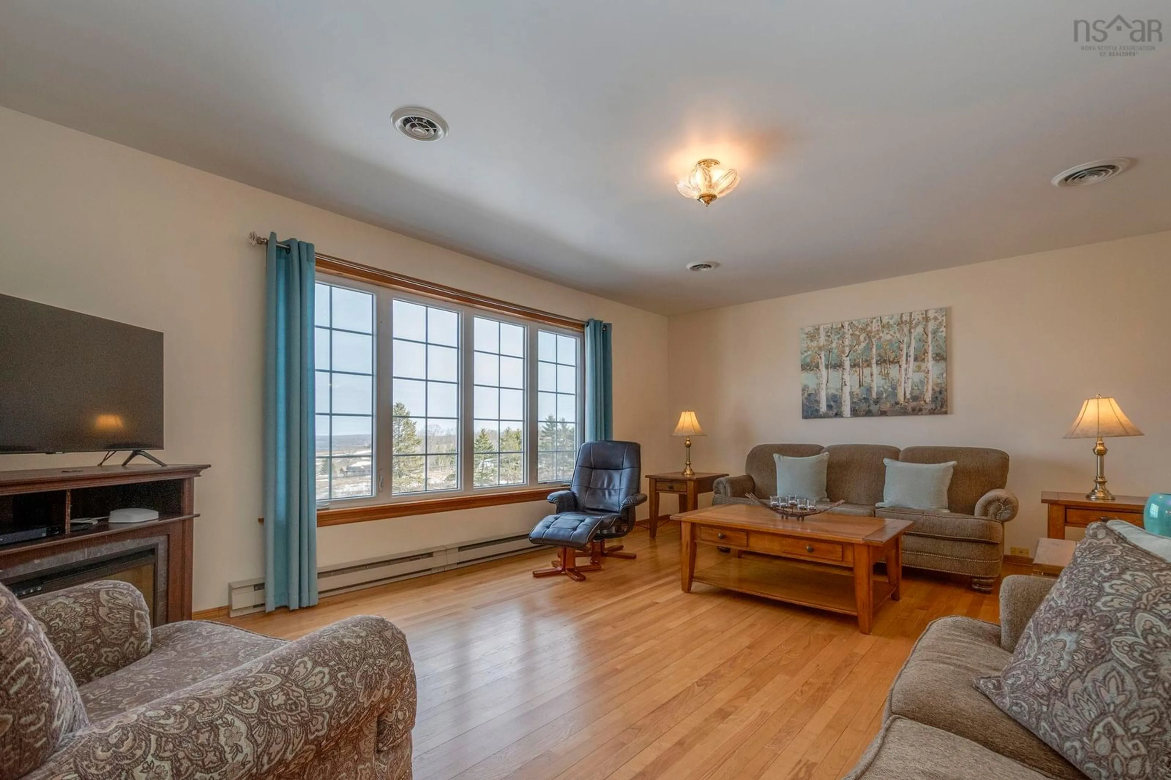 Living room with furniture, wood/laminate floor for 33 Oak Island Rd, Avonport Nova Scotia B4P 2R3