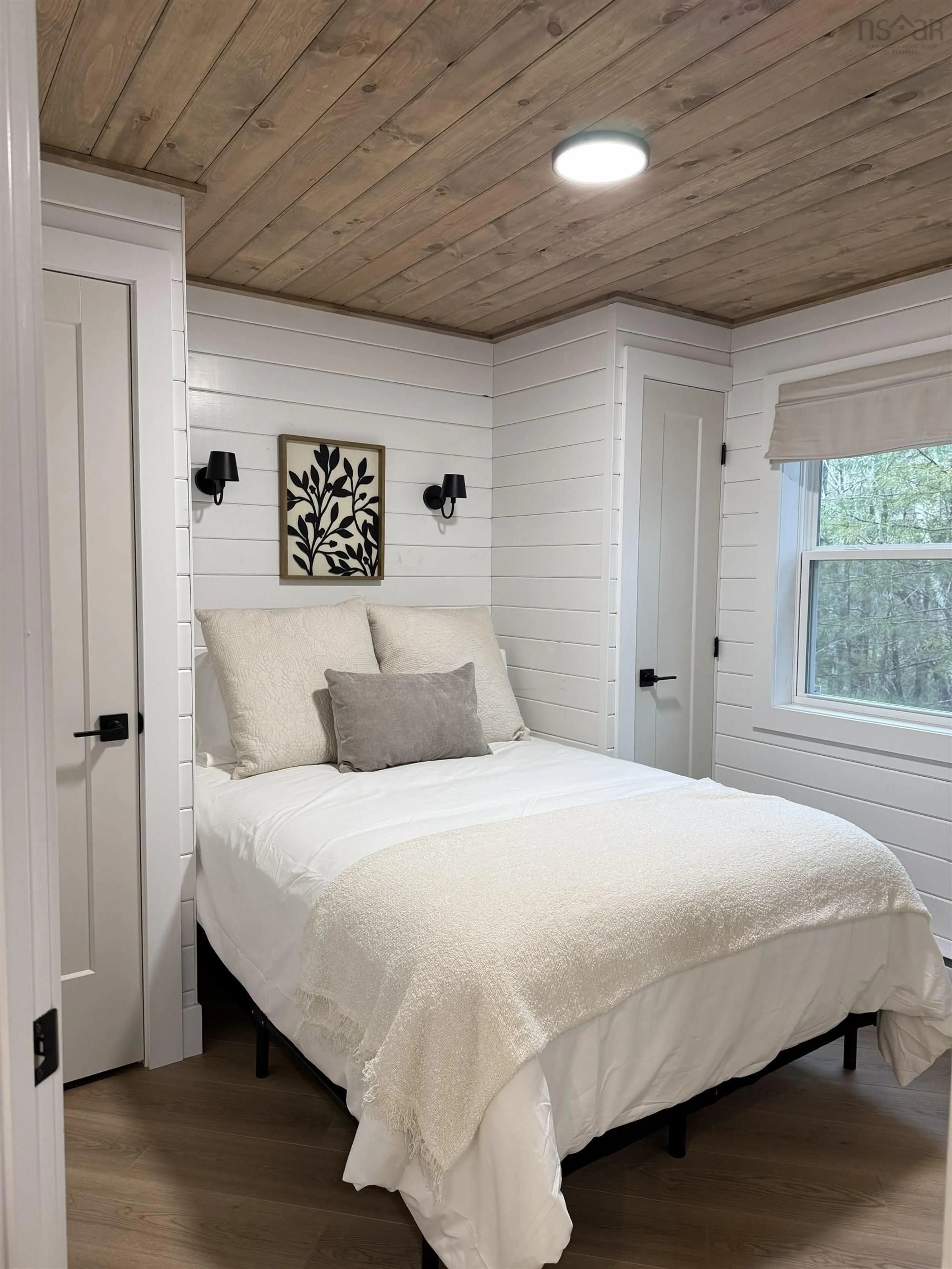 Bedroom with bed, wood/laminate floor for 21 Beechwood Ridge Rd, Labelle Nova Scotia B0T 1E0