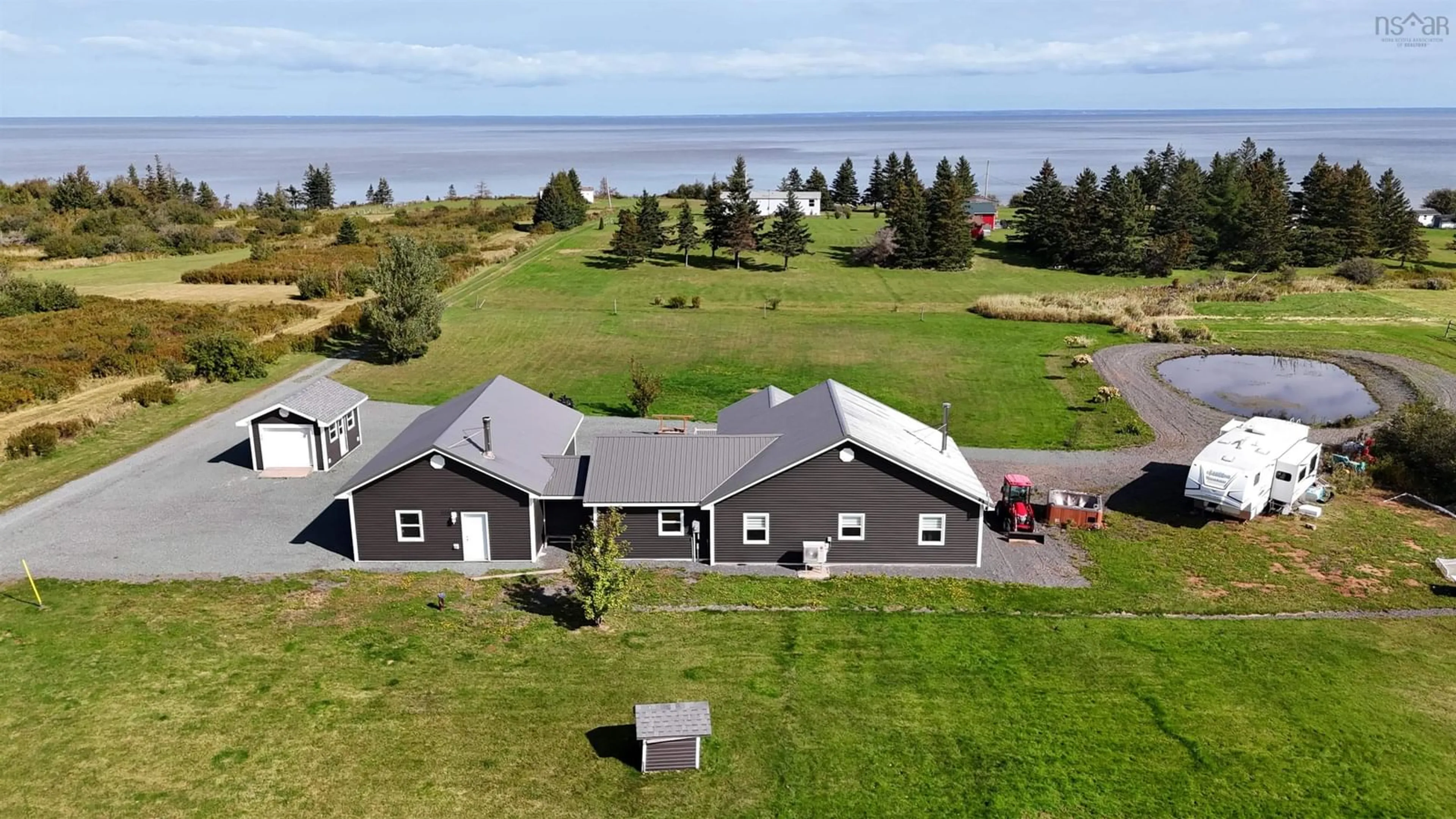 A pic from outside/outdoor area/front of a property/back of a property/a pic from drone, water/lake/river/ocean view for 26 Macmaster Lane, Seafoam Nova Scotia B0K 1N0