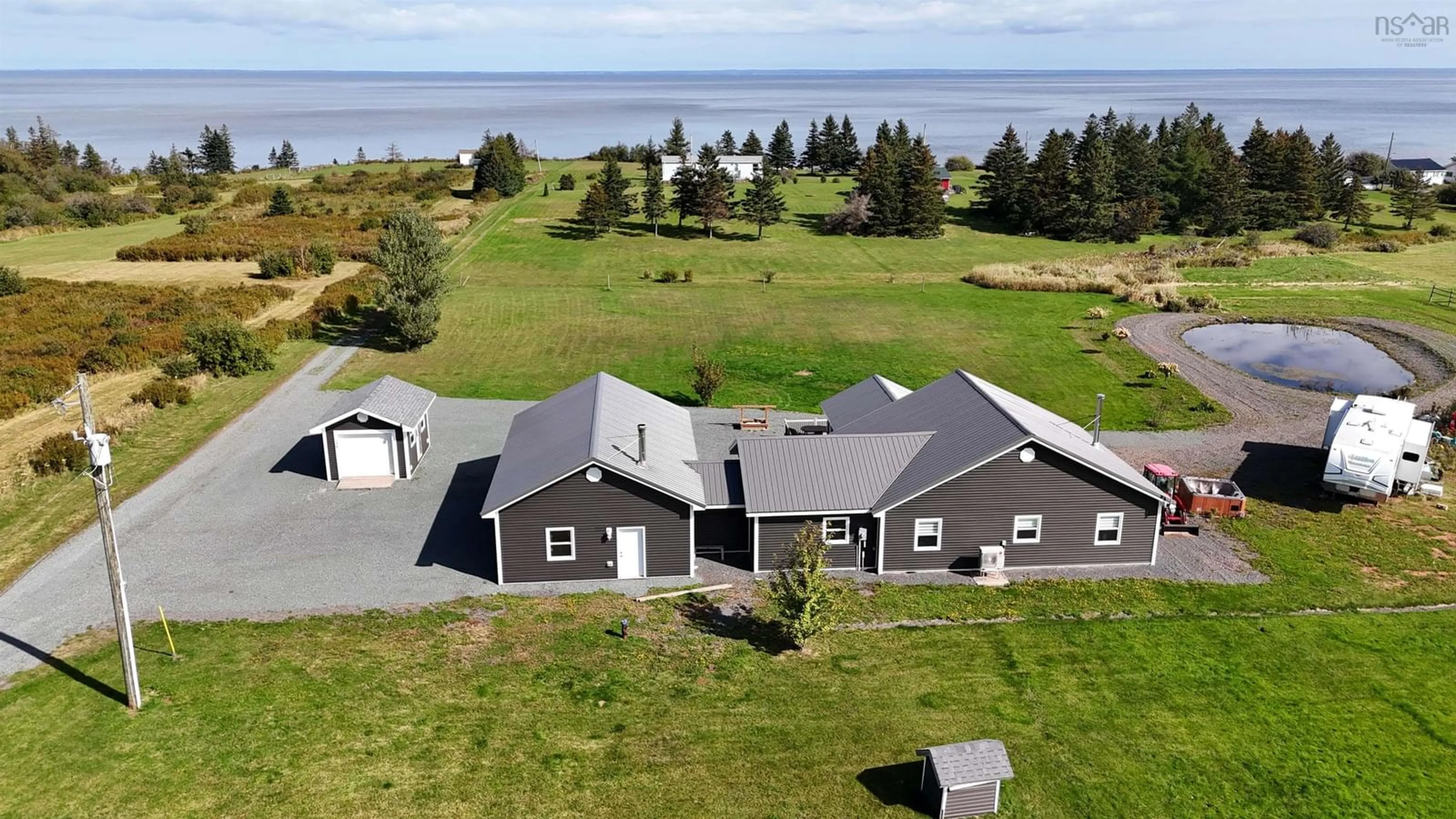 A pic from outside/outdoor area/front of a property/back of a property/a pic from drone, water/lake/river/ocean view for 26 Macmaster Lane, Seafoam Nova Scotia B0K 1N0