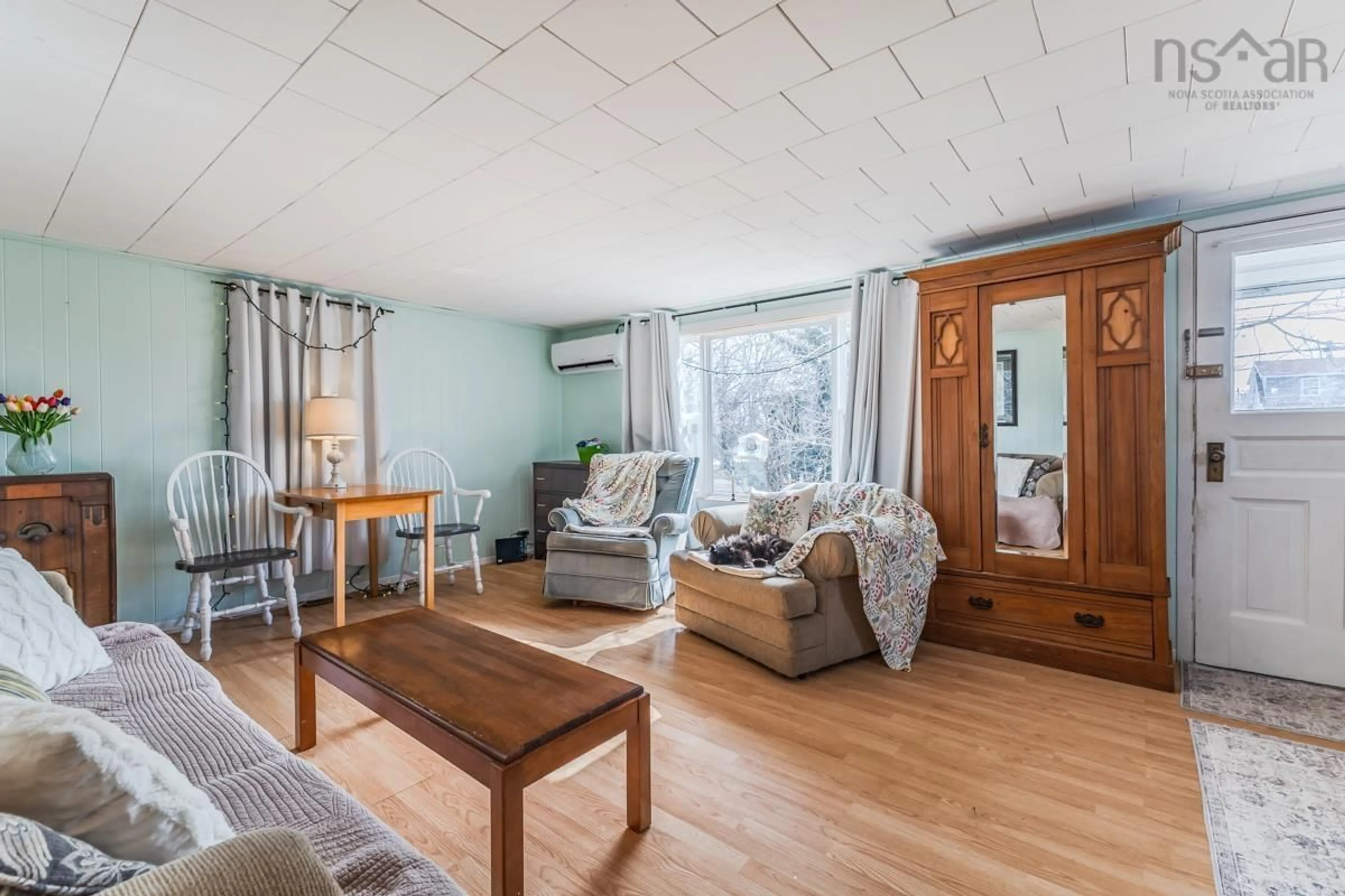 Living room with furniture, wood/laminate floor for 17 Lake Rd, Tatamagouche Nova Scotia B0K 1V0