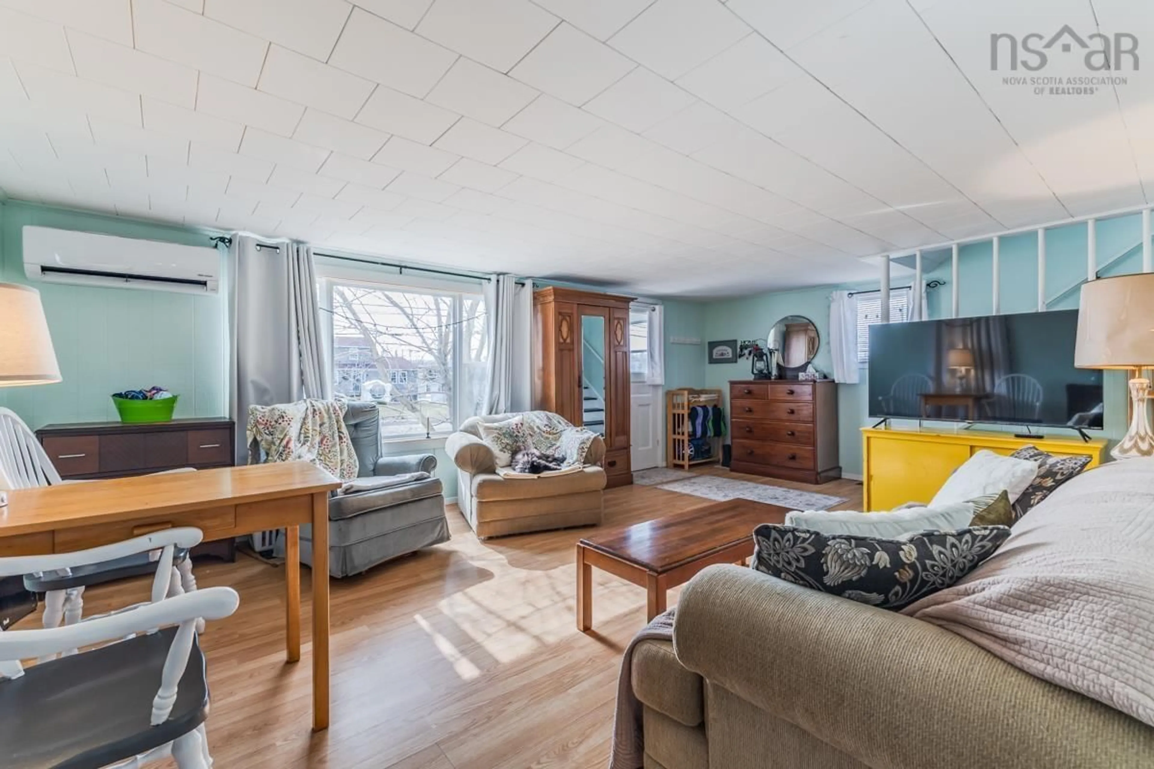 Living room with furniture, wood/laminate floor for 17 Lake Rd, Tatamagouche Nova Scotia B0K 1V0