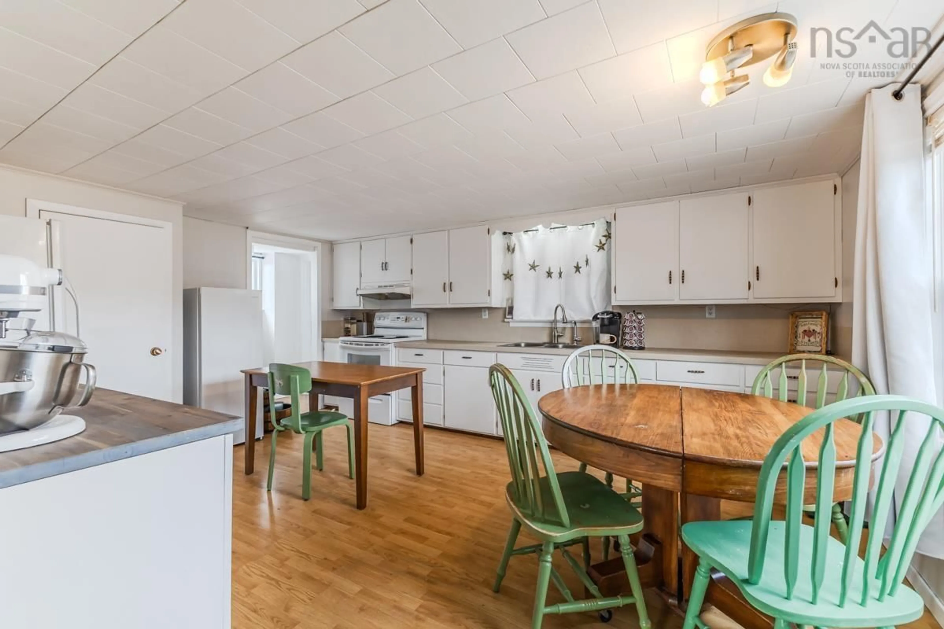 Open concept kitchen, wood/laminate floor for 17 Lake Rd, Tatamagouche Nova Scotia B0K 1V0