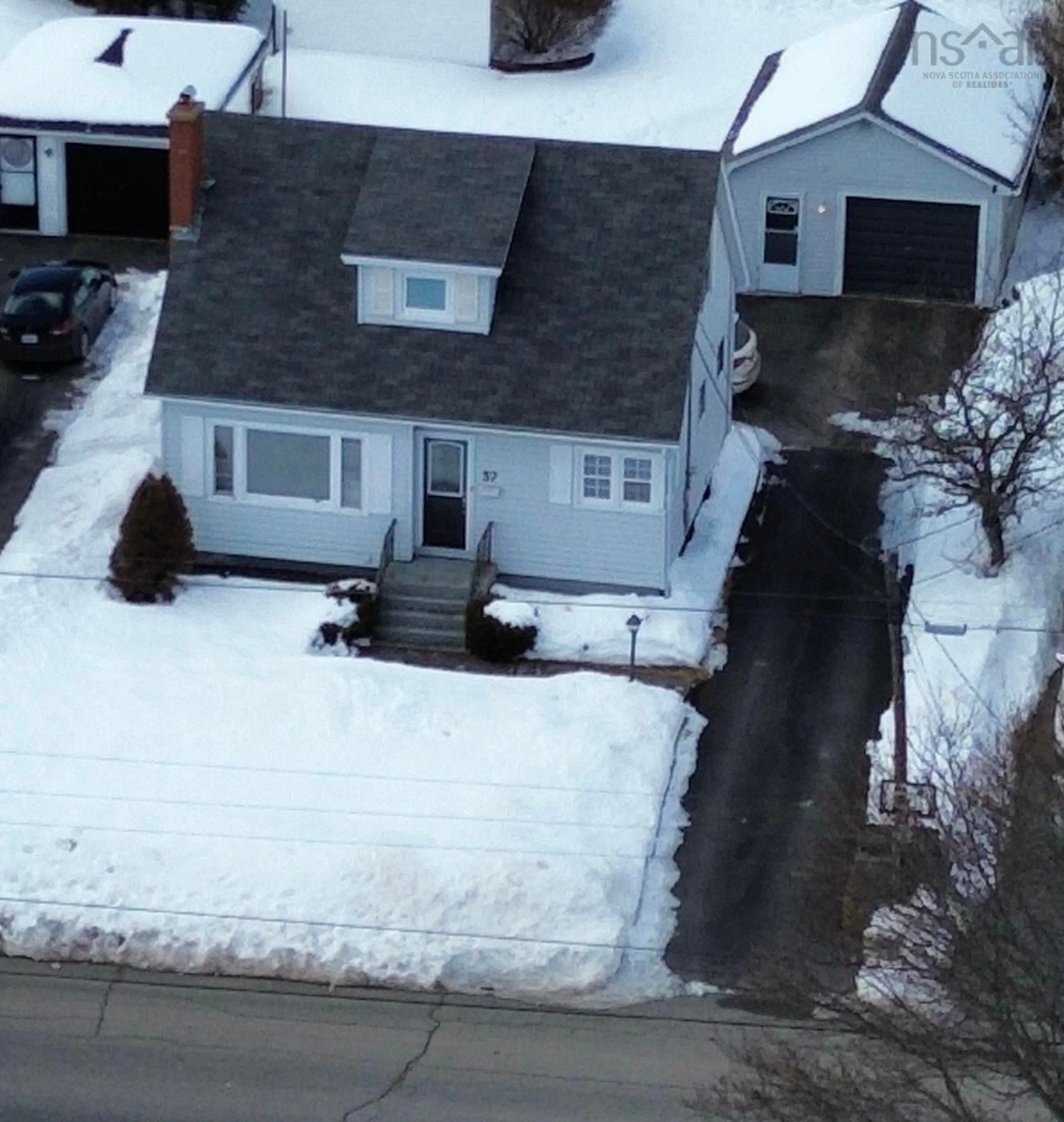 A pic from outside/outdoor area/front of a property/back of a property/a pic from drone, street for 37 Kelmere Dr, Sydney River Nova Scotia B1R 1P9