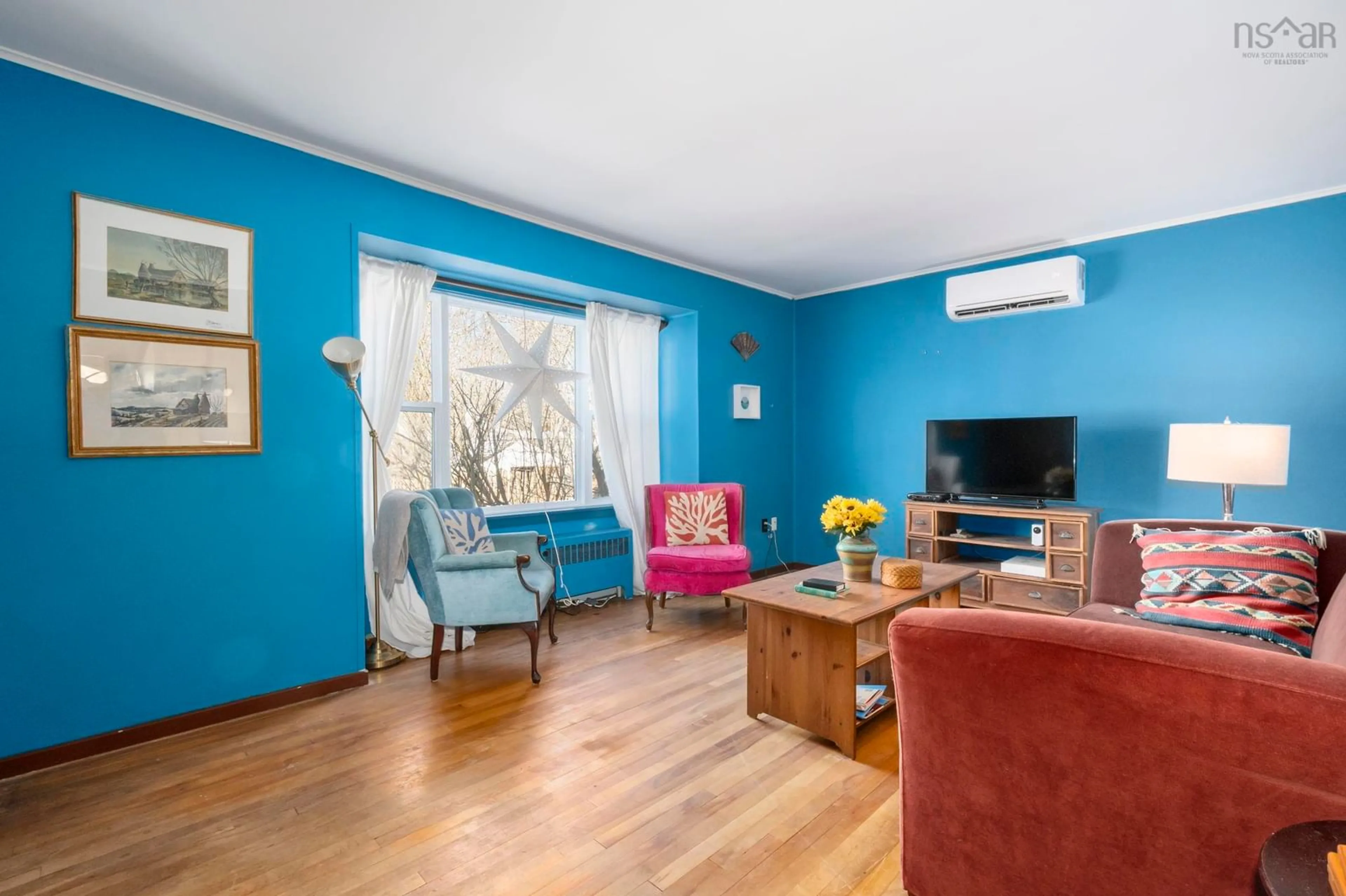 Living room with furniture, wood/laminate floor for 6937 Vaughan Ave, Halifax Nova Scotia B3L 2B7