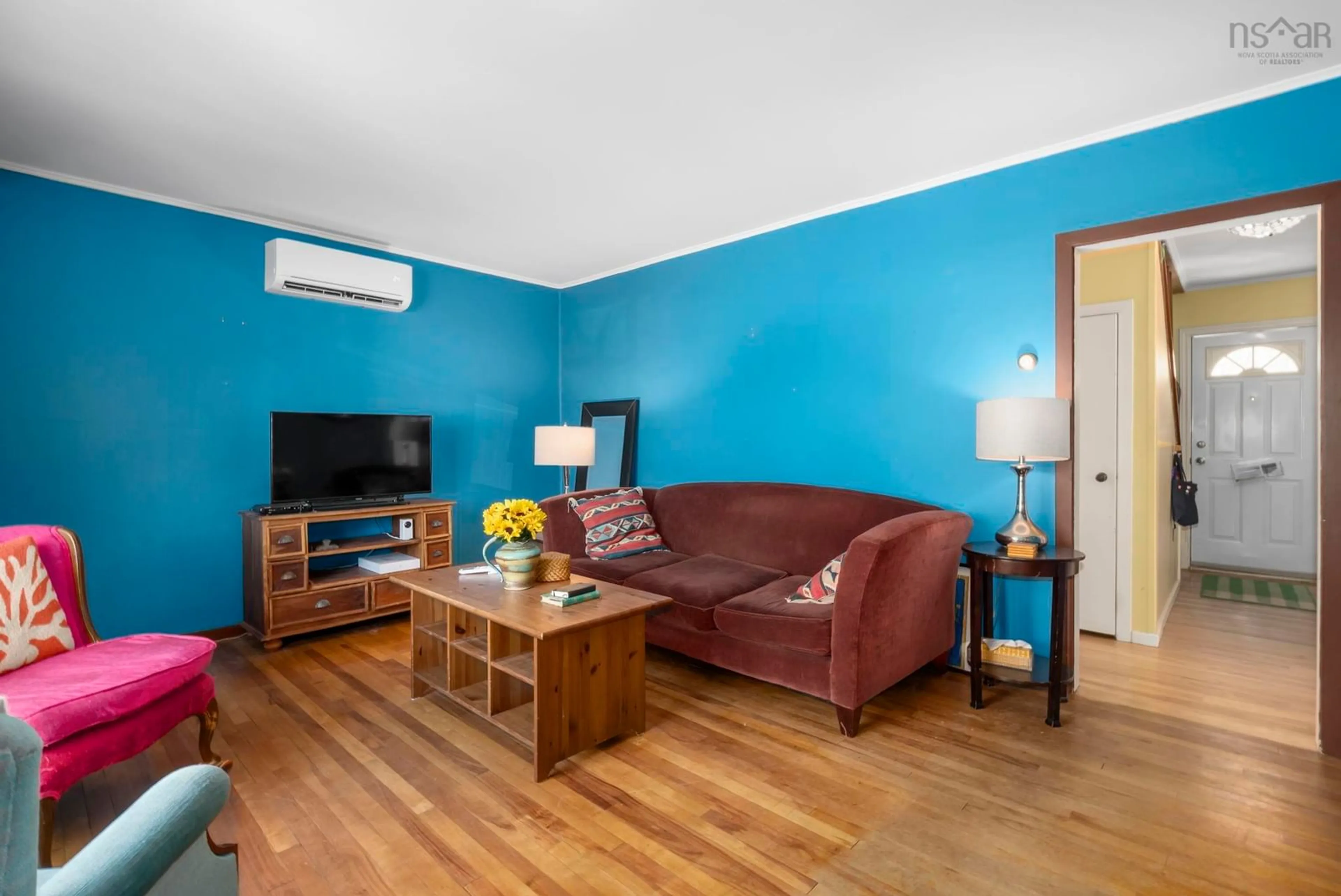 Living room with furniture, wood/laminate floor for 6937 Vaughan Ave, Halifax Nova Scotia B3L 2B7