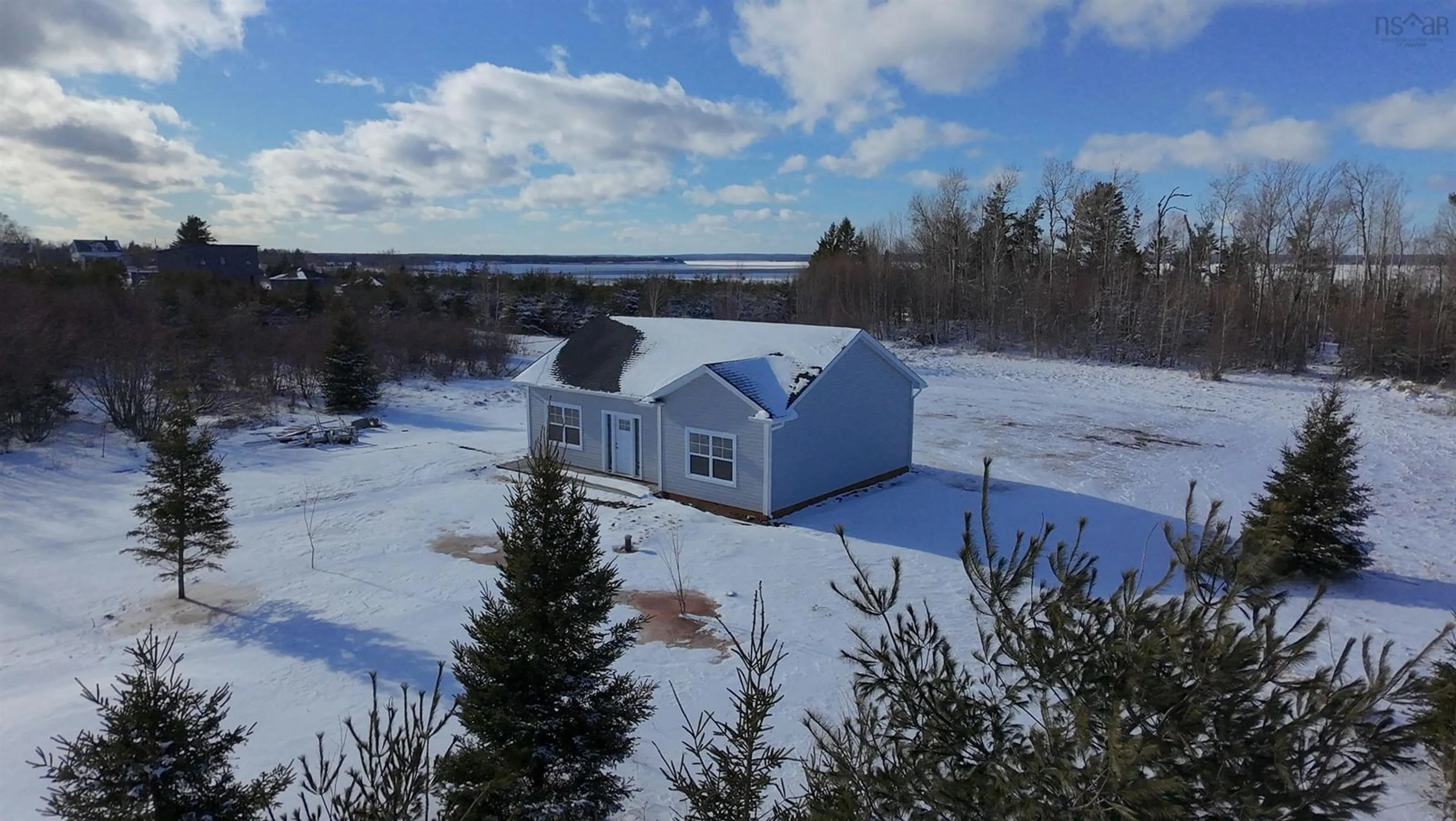 A pic from outside/outdoor area/front of a property/back of a property/a pic from drone, water/lake/river/ocean view for 55 Brule Shore Rd, Barrachois Nova Scotia B0K 1V0