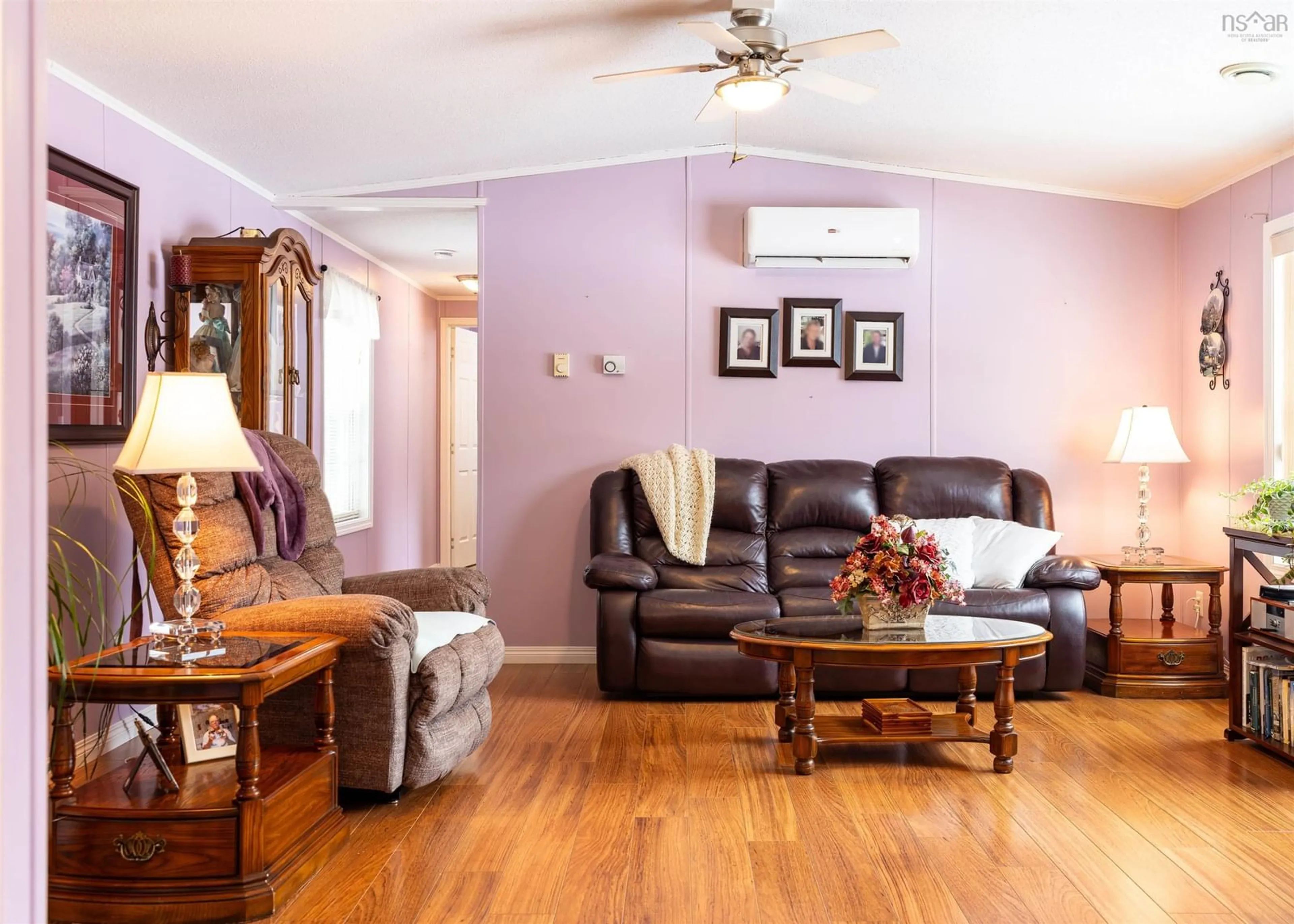 Living room with furniture, wood/laminate floor for 16568 Highway 316, Country Harbour Nova Scotia B0H 1J0