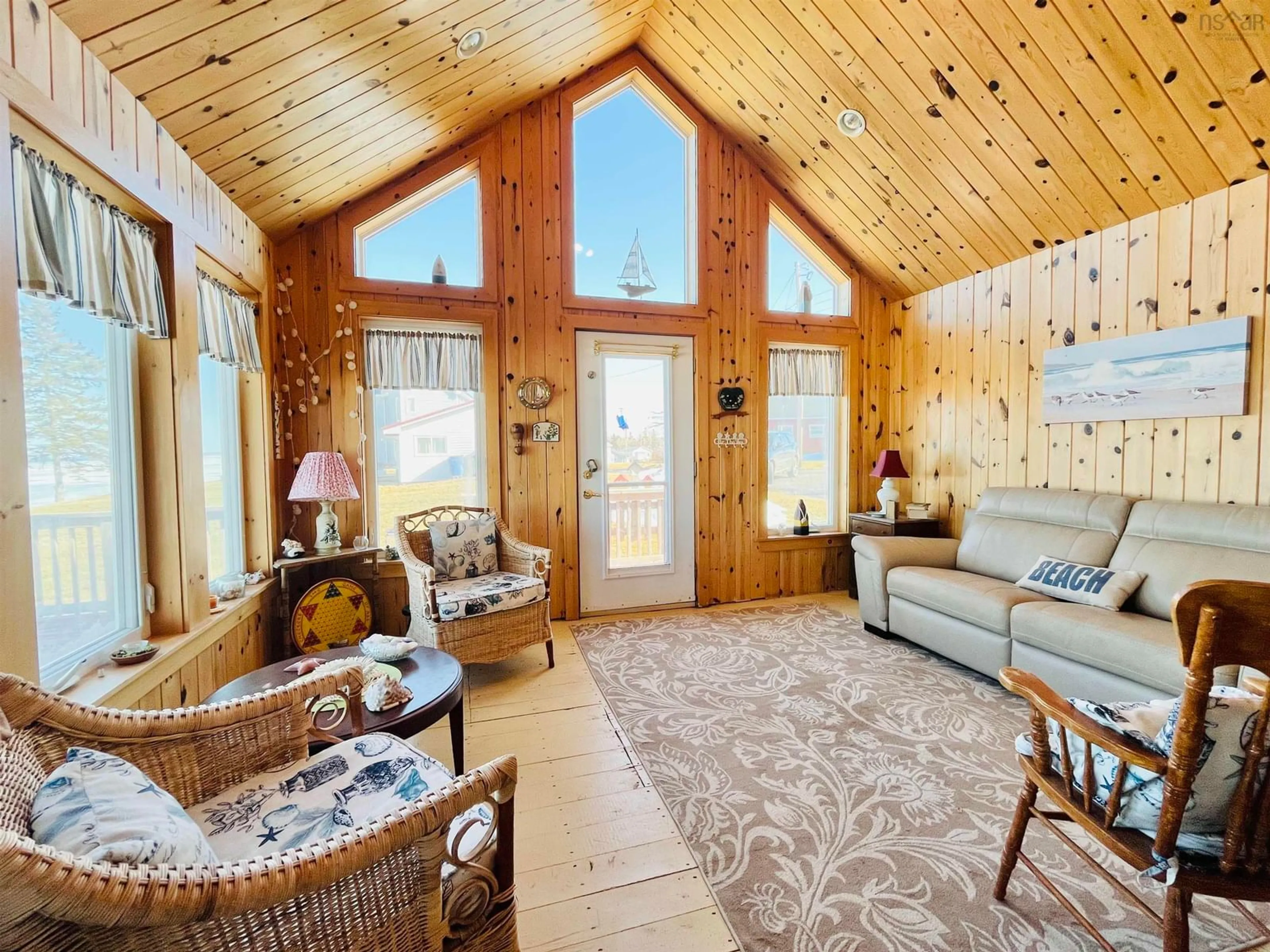 Living room with furniture, wood/laminate floor for 219 Norm Greene Trail, Port Howe Nova Scotia B0K 1K0