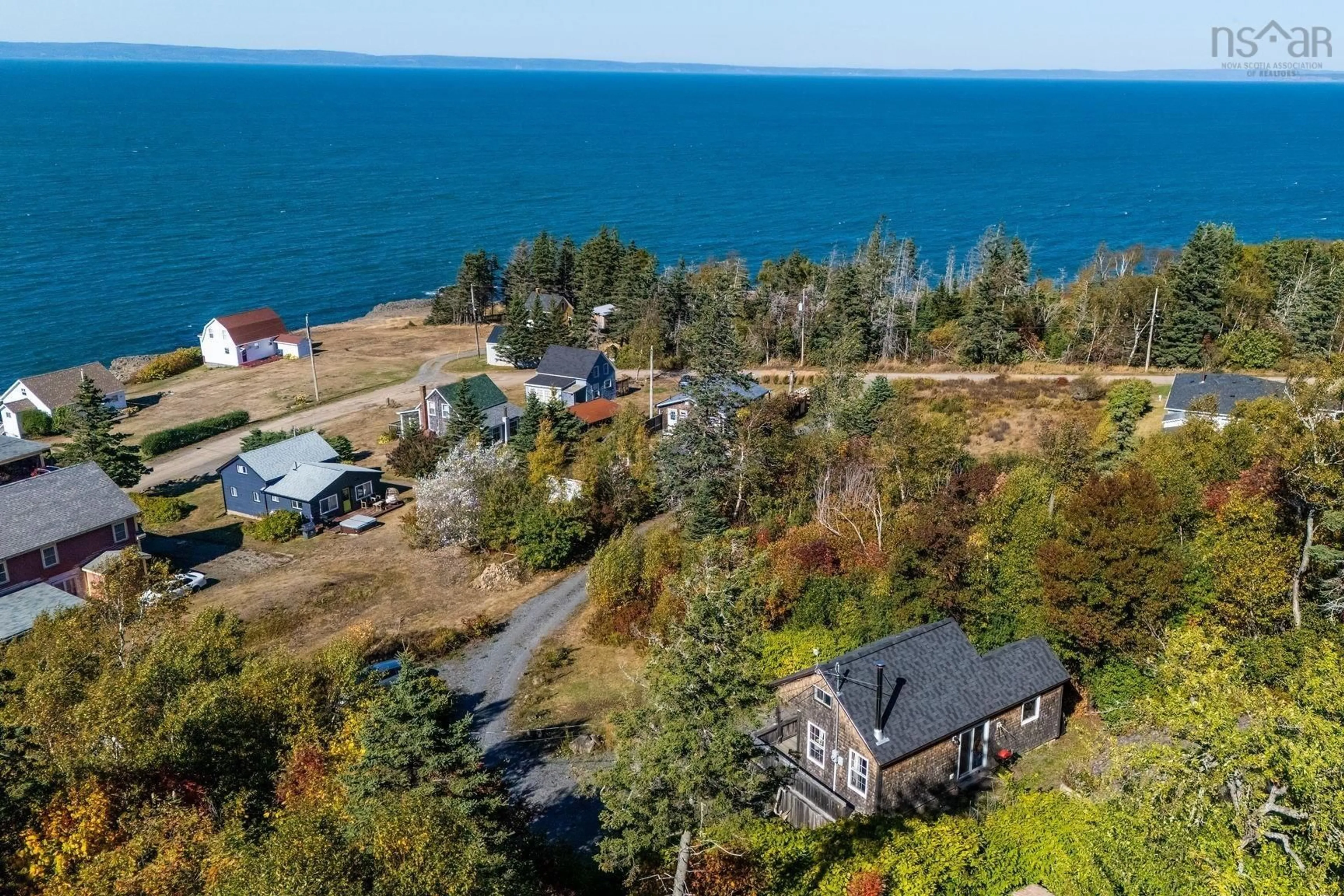 A pic from outside/outdoor area/front of a property/back of a property/a pic from drone, water/lake/river/ocean view for 54 Cove Rd, Halls Harbour Nova Scotia B0P 1J0