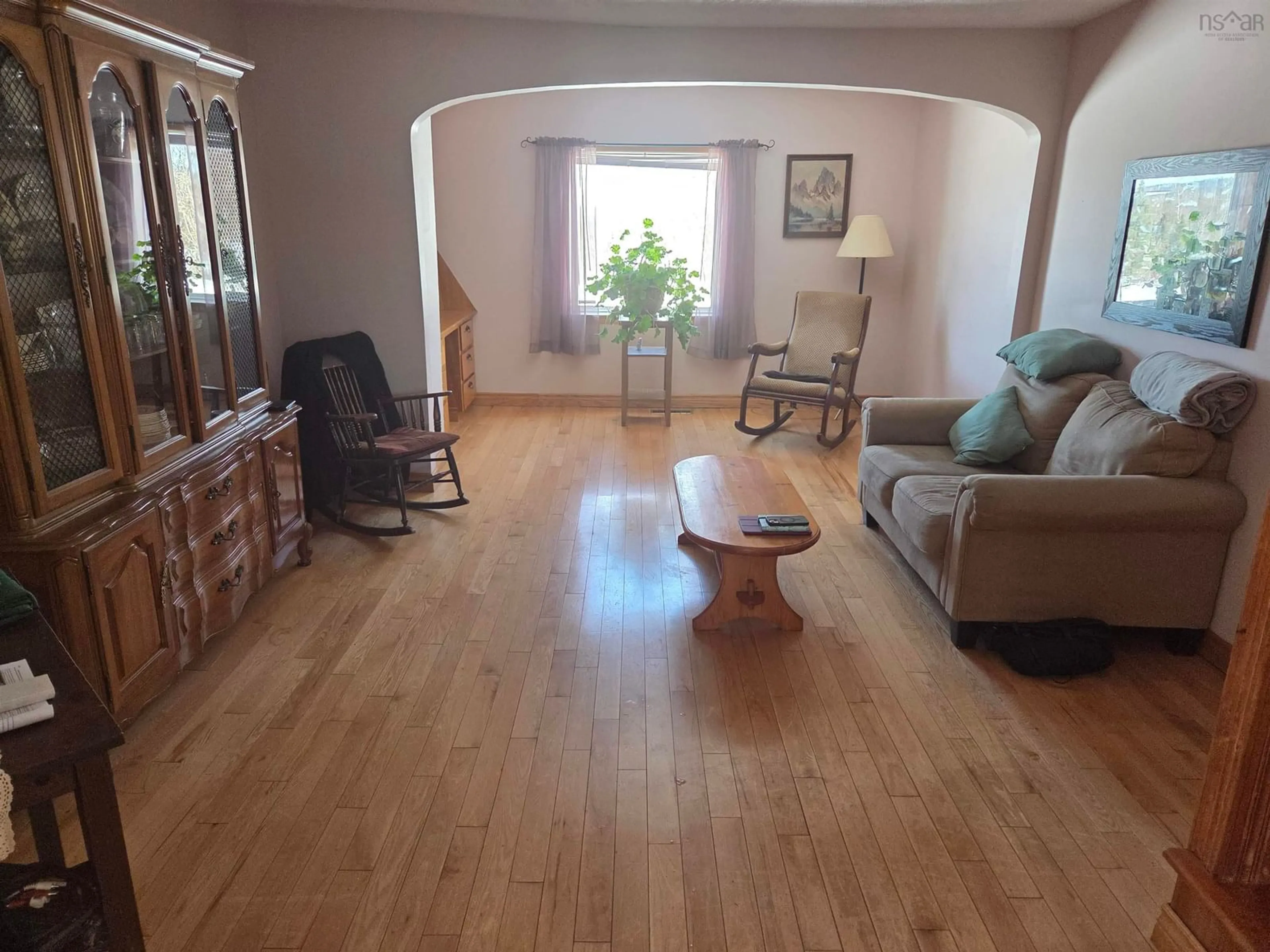 Living room with furniture, wood/laminate floor for 4105 Highway 316 Hwy, St Andrew's Nova Scotia B2G 2L4
