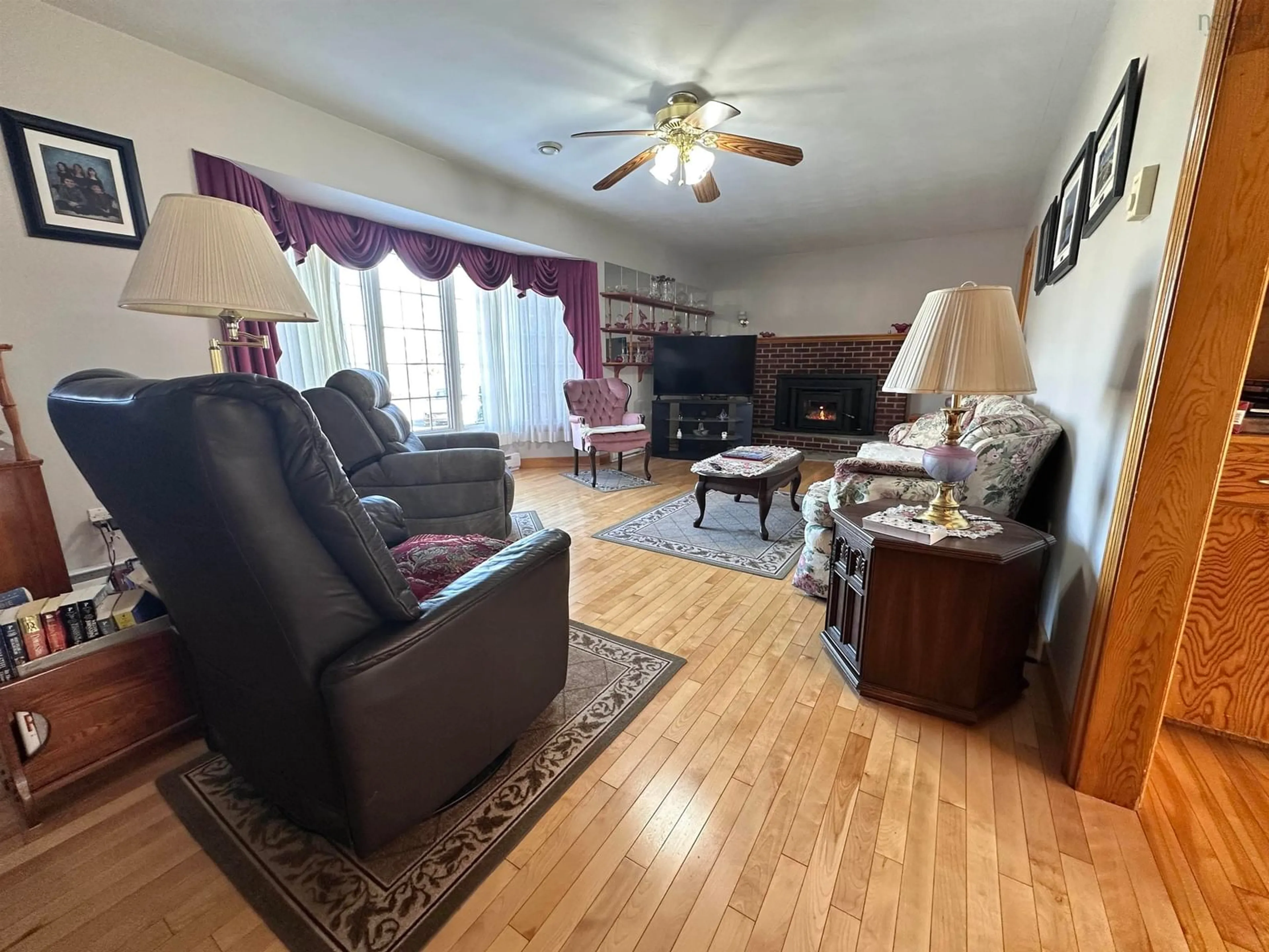 Living room with furniture, wood/laminate floor for 46 Long Cove Rd, Port Medway Nova Scotia B0J 2T0