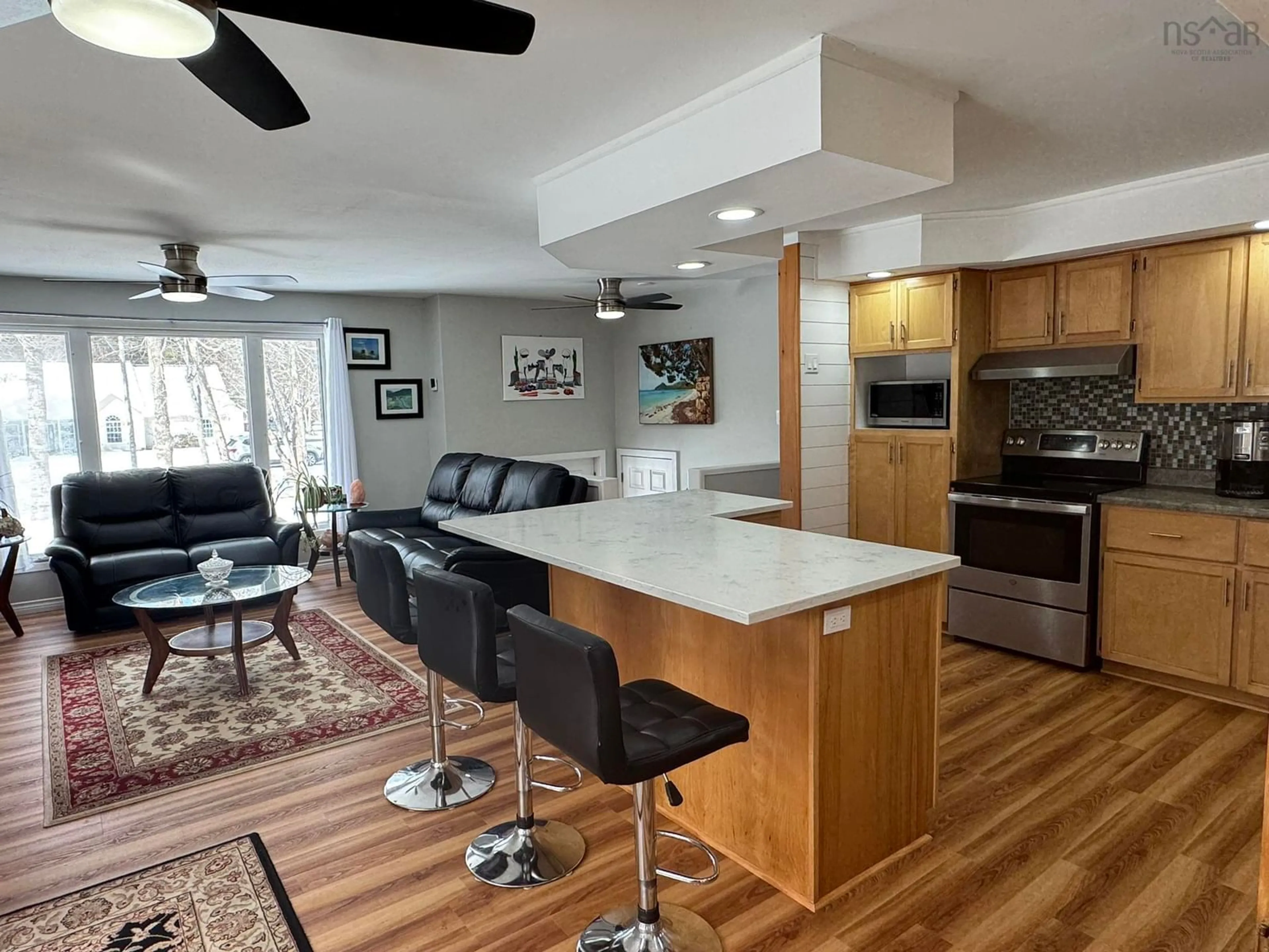 Open concept kitchen, wood/laminate floor for 78 Birch Dr, Meadowvale Nova Scotia B0P 1R0