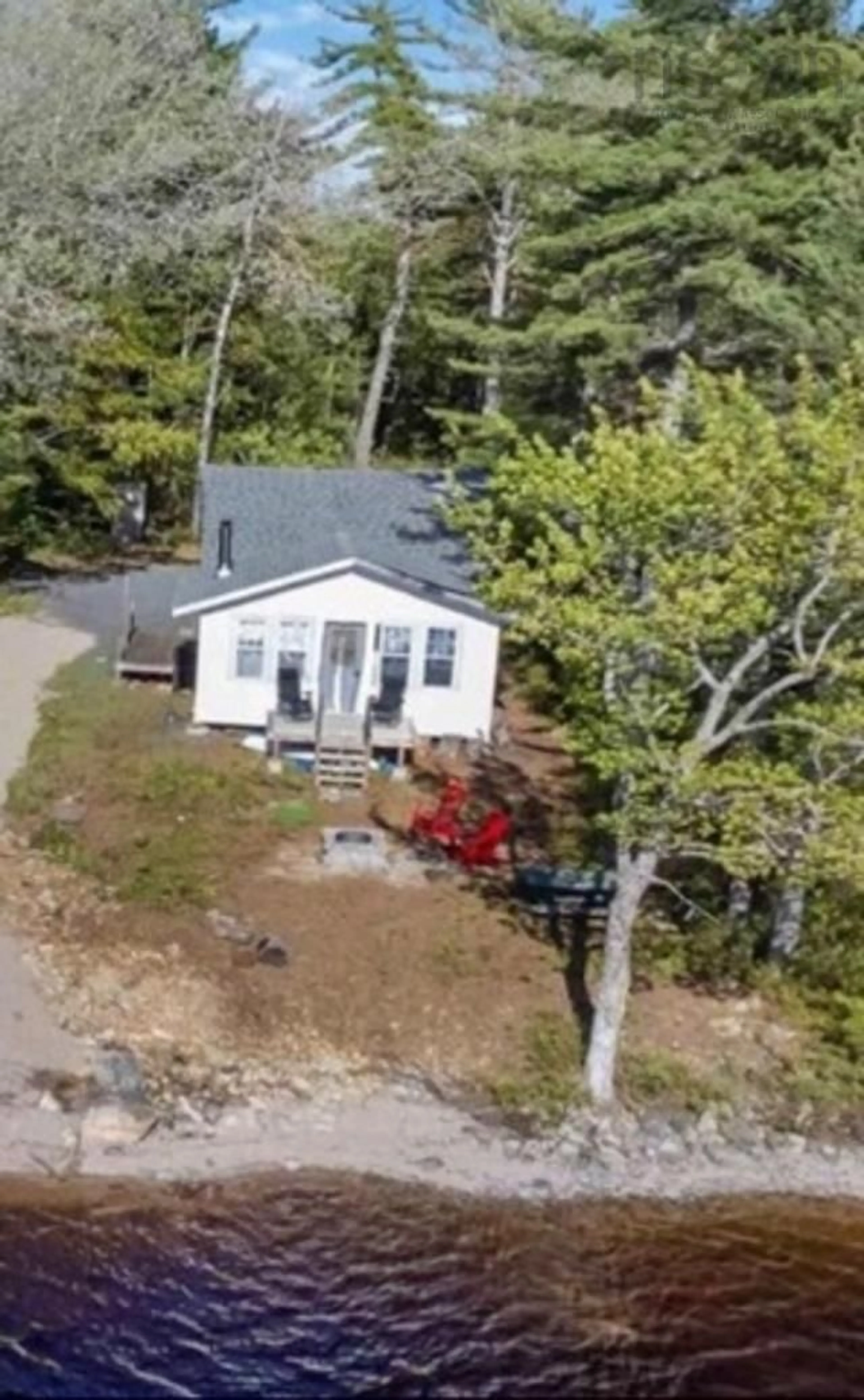 A pic from outside/outdoor area/front of a property/back of a property/a pic from drone, unknown for 576 Second Brook Rd, Western Shore Nova Scotia B0J 1K0