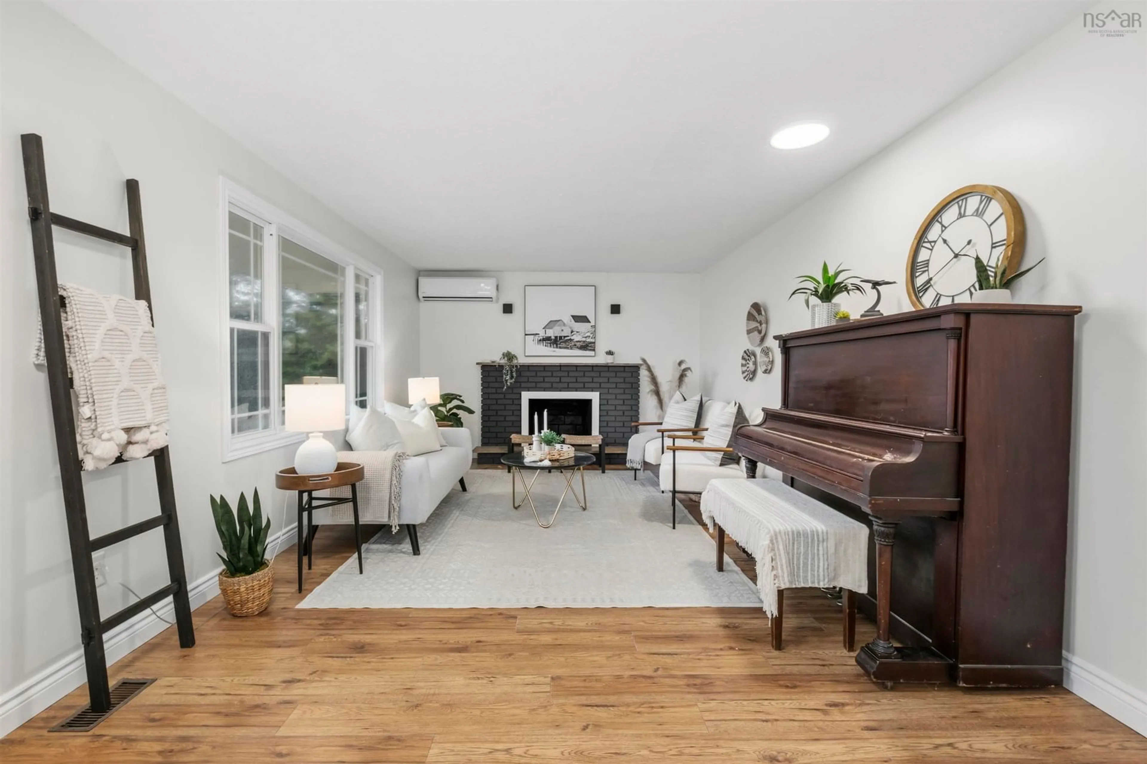 Living room with furniture, wood/laminate floor for 869 West Pennant Rd, West Pennant Nova Scotia B3V 1M4
