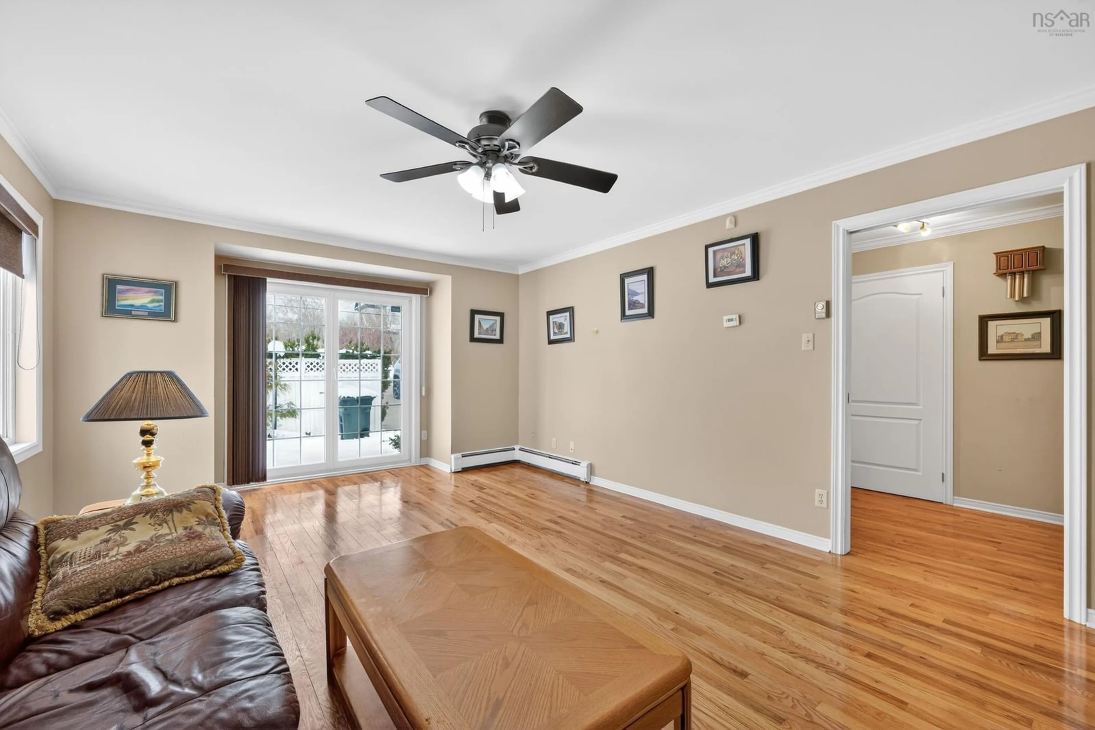 Living room with furniture, wood/laminate floor for 28 Old Kings Rd, Sydney Nova Scotia B1S 2B5