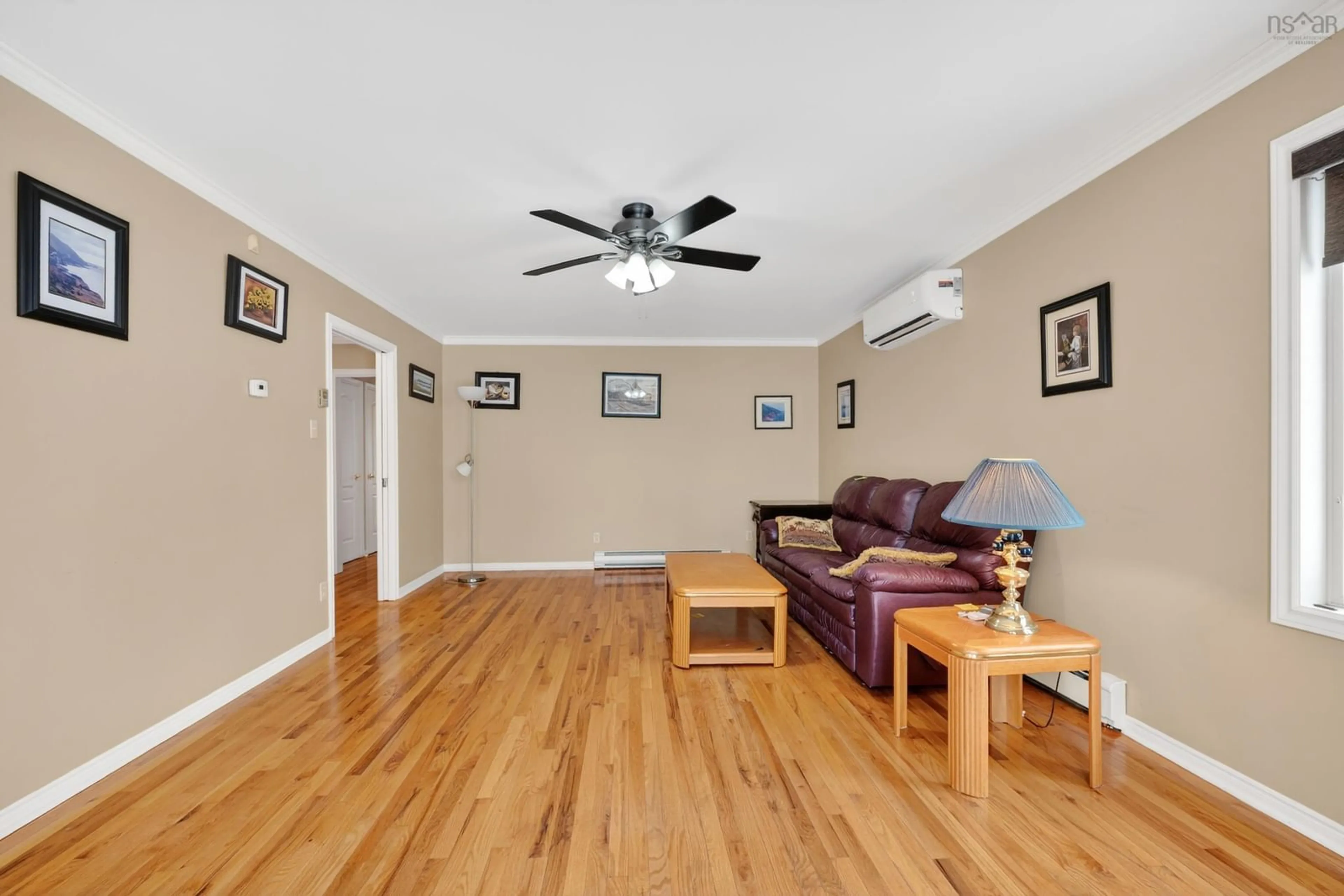 Living room with furniture, wood/laminate floor for 28 Old Kings Rd, Sydney Nova Scotia B1S 2B5