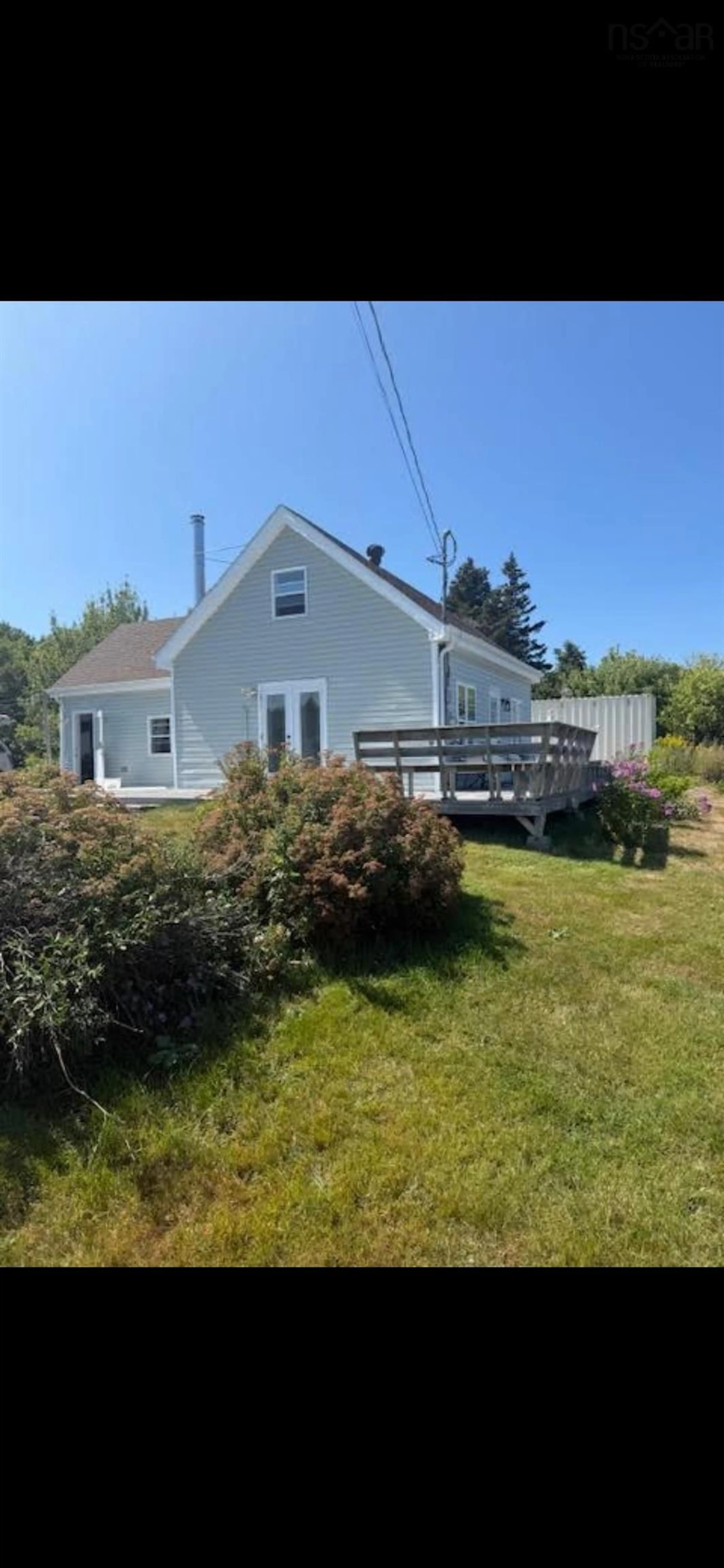 A pic from outside/outdoor area/front of a property/back of a property/a pic from drone, water/lake/river/ocean view for 5863 Highway 16, Queensport Nova Scotia B0H 1N0