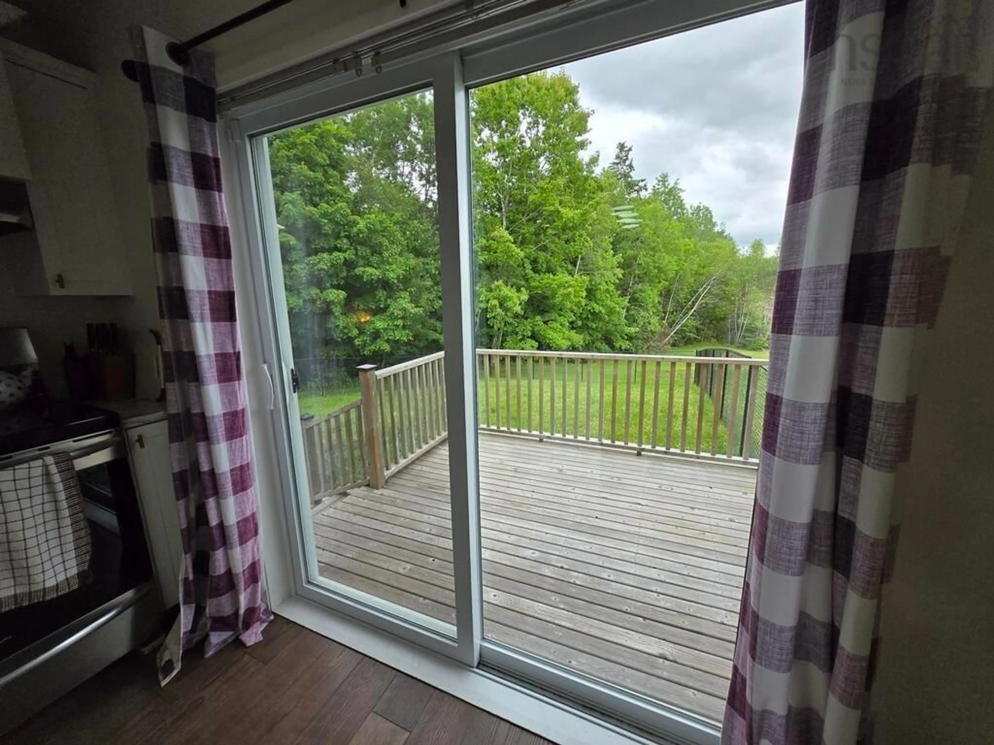 Balcony in the apartment, forest/trees view for 8500 Sherbrooke Rd, Mcphersons Mills Nova Scotia B0K 1W0