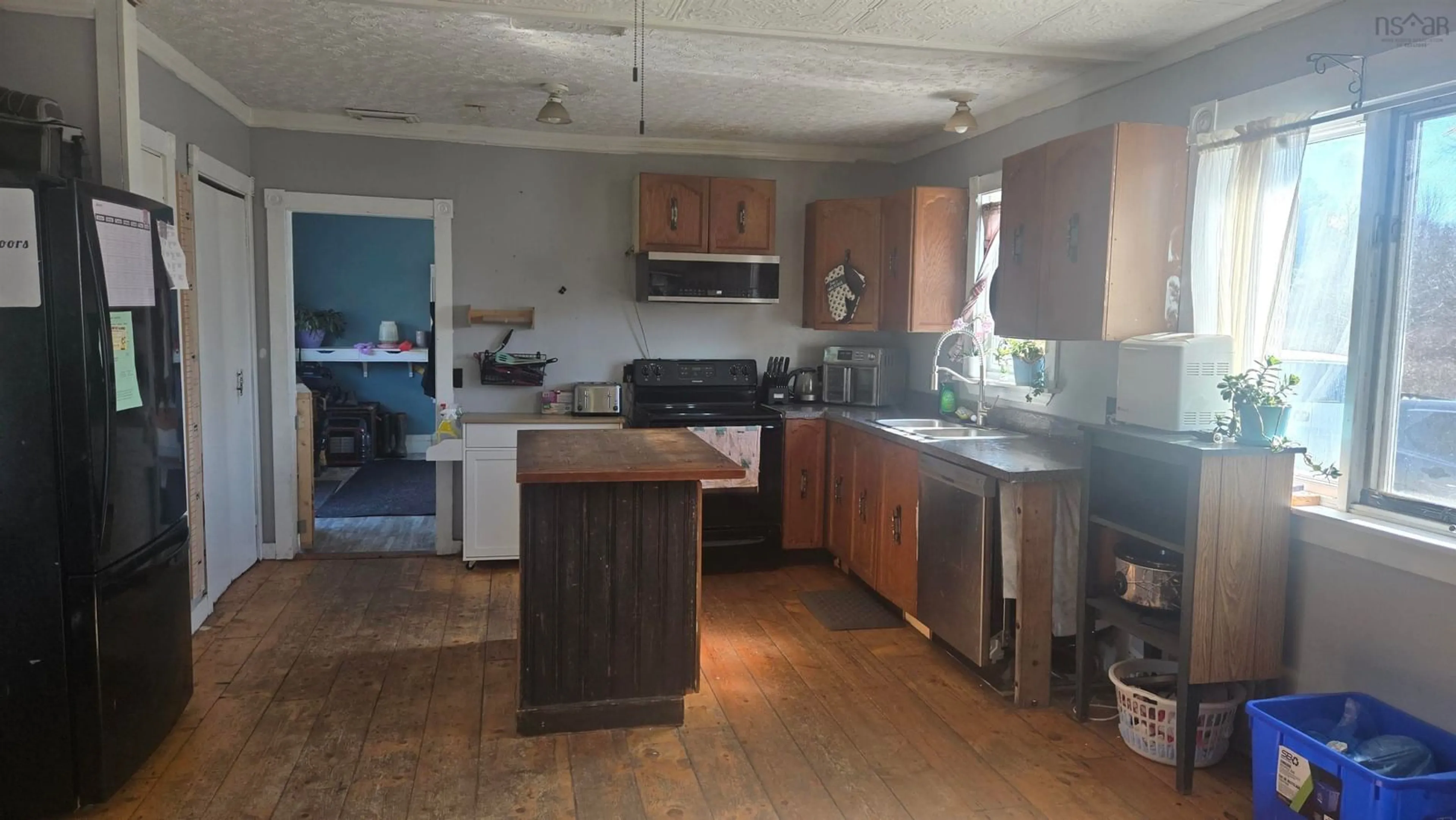 Open concept kitchen, wood/laminate floor for 8094 Highway 101, Barton Nova Scotia B0W 1H0