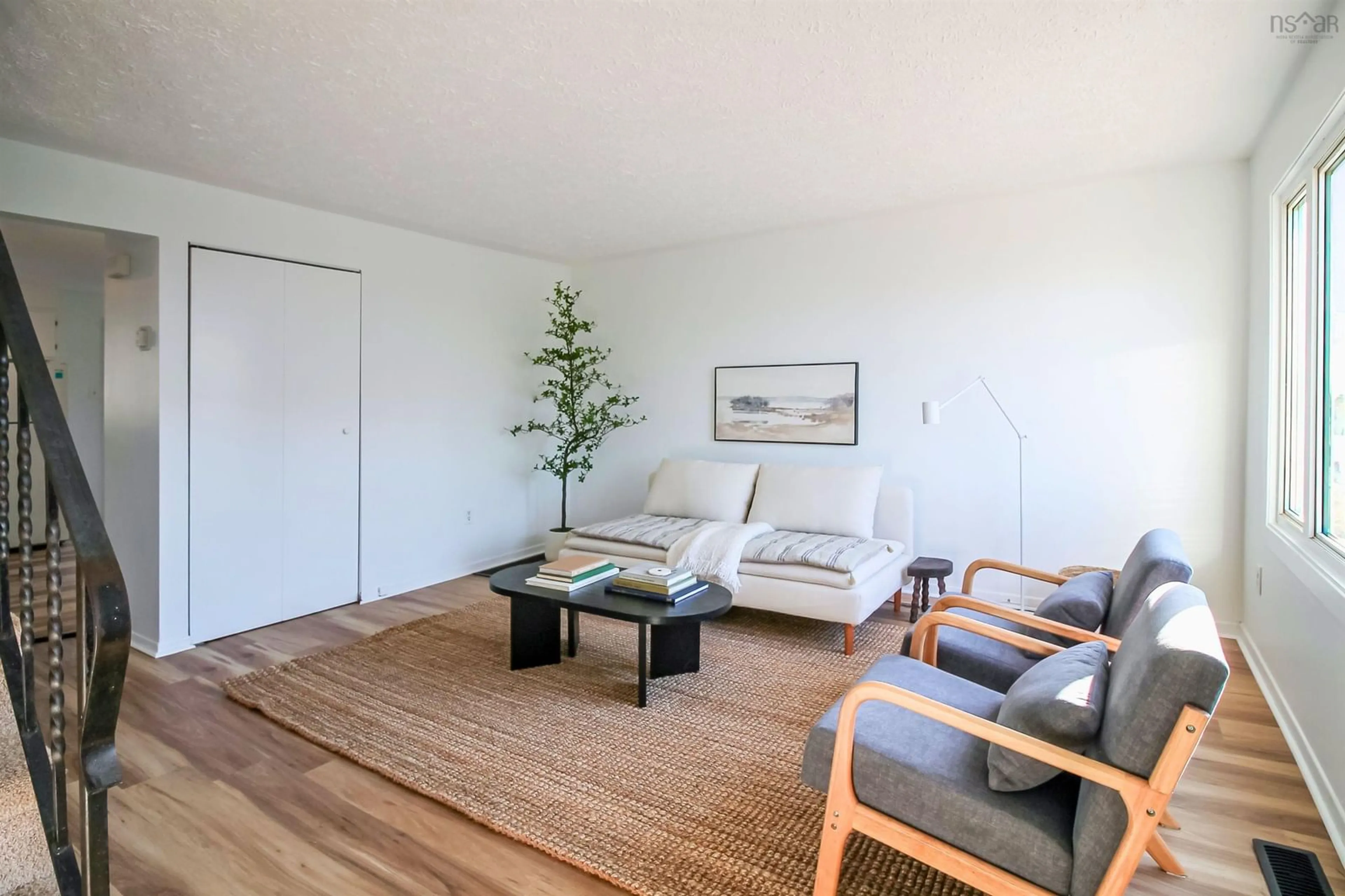 Living room with furniture, wood/laminate floor for 36 Regal Rd, Dartmouth Nova Scotia B2W 4H6