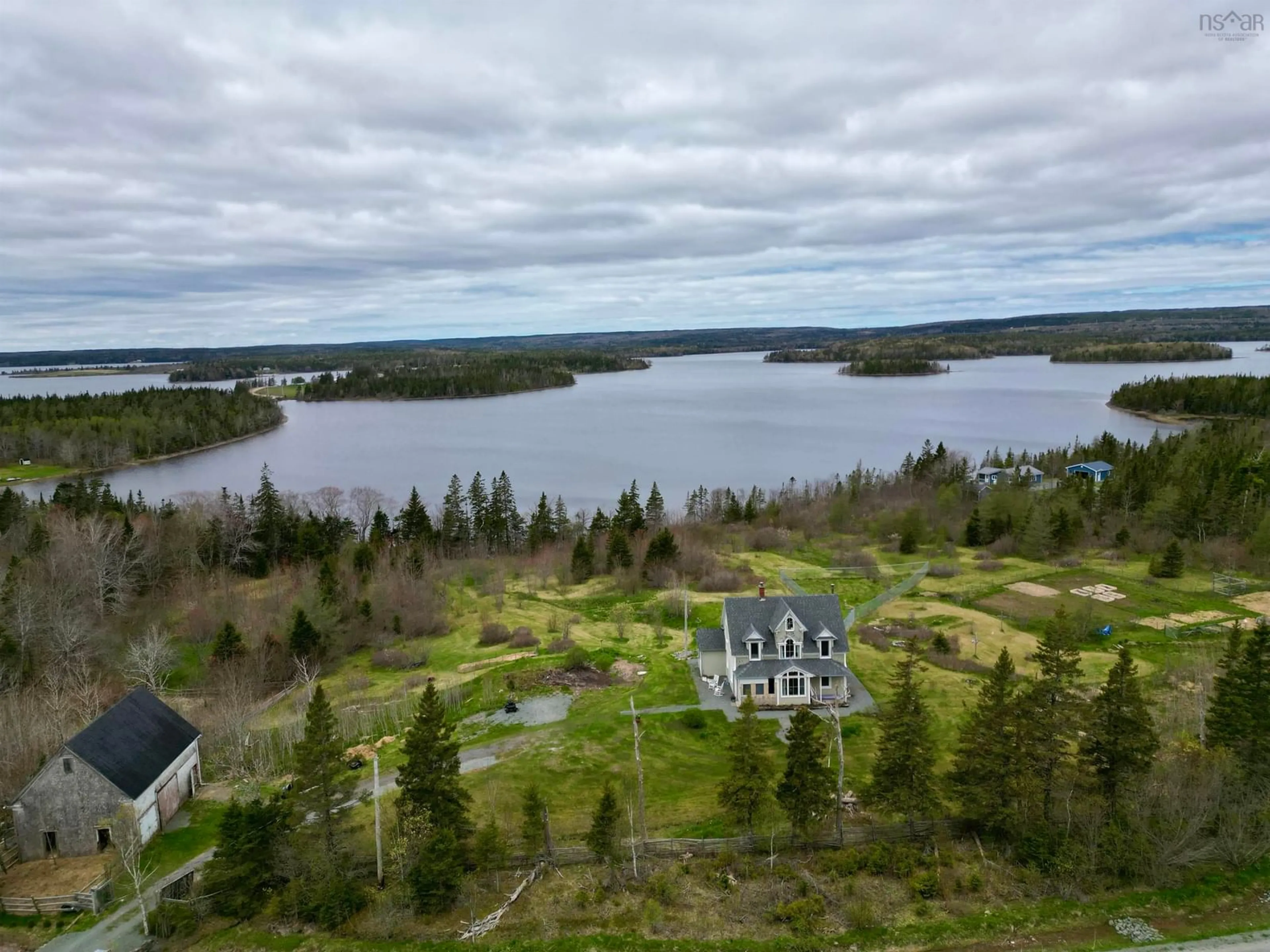 A pic from outside/outdoor area/front of a property/back of a property/a pic from drone, water/lake/river/ocean view for 3463 Loch Lomond Rd., Loch Lomond Nova Scotia B2E 1C5