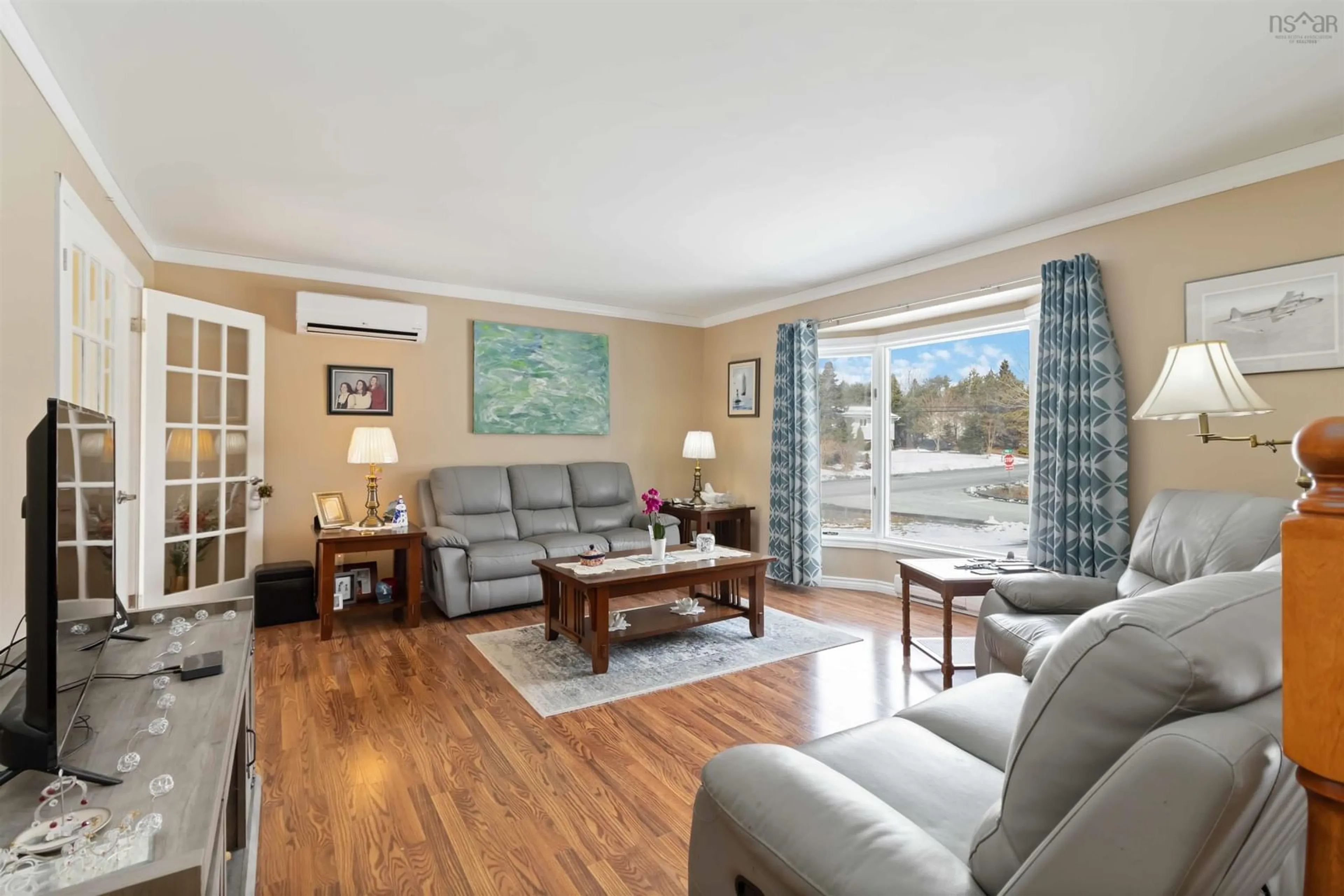 Living room with furniture, wood/laminate floor for 110 Hebb Dr, Lawrencetown Nova Scotia B2Z 1C8