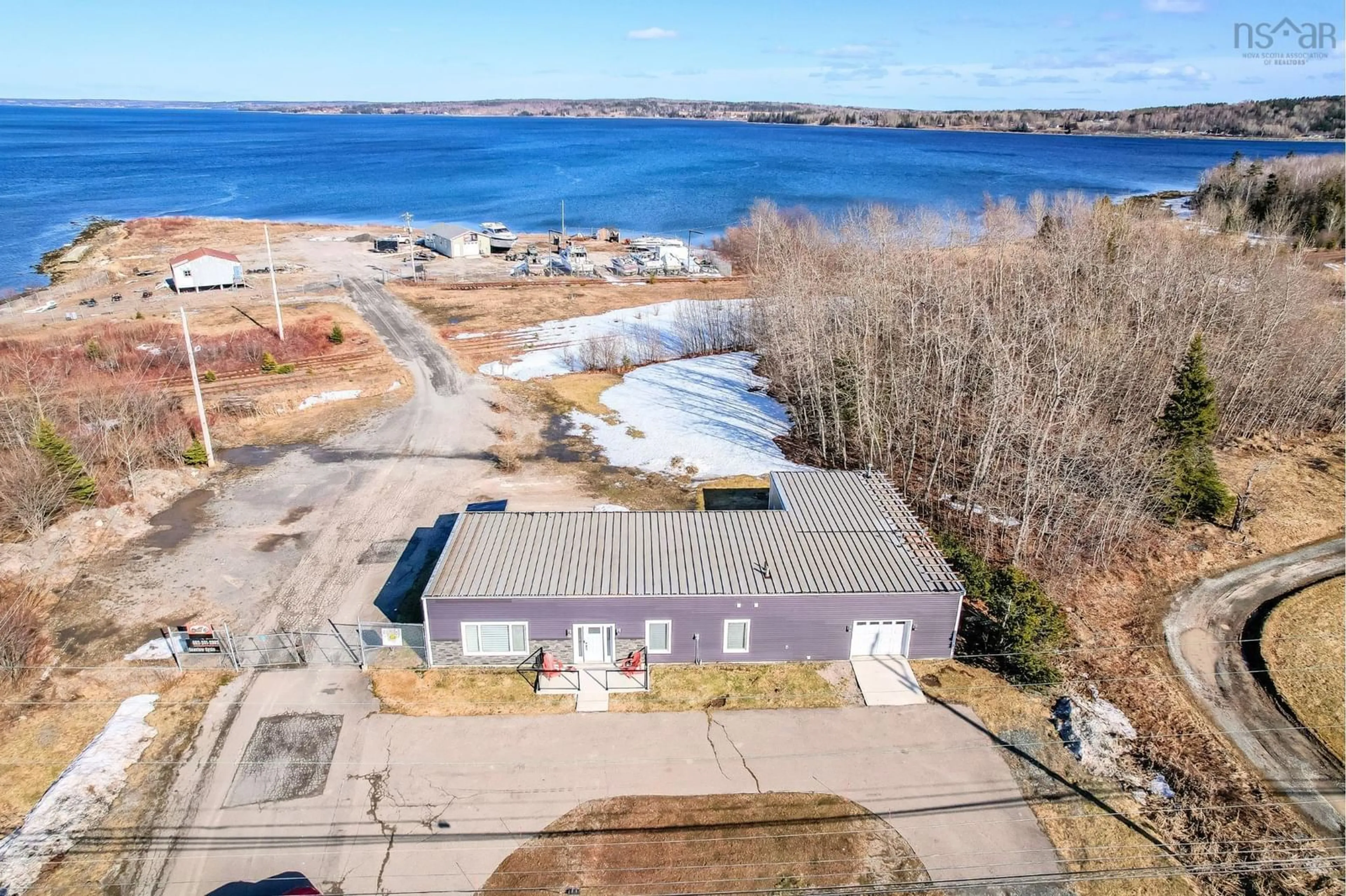 A pic from outside/outdoor area/front of a property/back of a property/a pic from drone, water/lake/river/ocean view for 1526 Keltic Dr, Leitches Creek Nova Scotia B2A 4Y1
