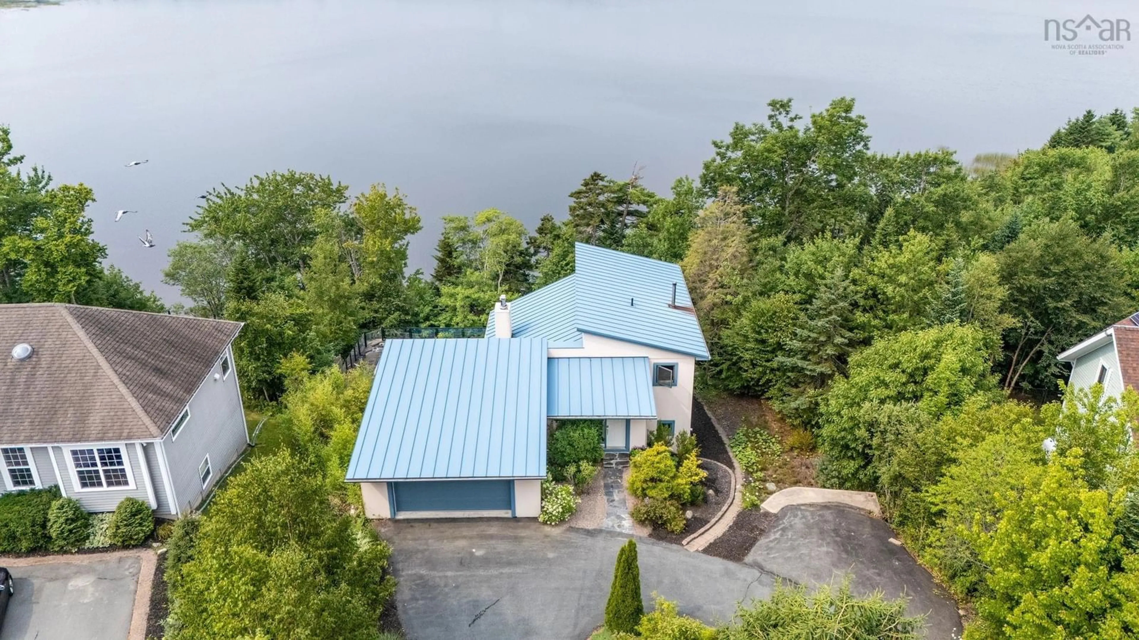 A pic from outside/outdoor area/front of a property/back of a property/a pic from drone, water/lake/river/ocean view for 49 Fairway Grove, Dartmouth Nova Scotia B2W 6M5